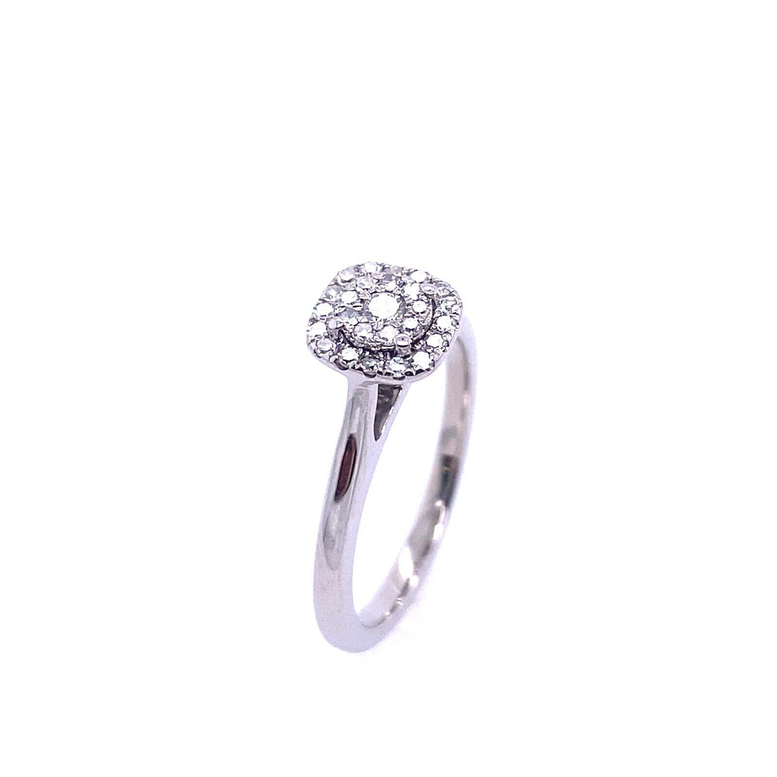 This beautiful 18ct white gold diamond ring features a cluster of round brilliant cut diamonds set into a cushion shaped frame, in total the ring features 0.50ct of diamonds.

Additional Information: 
Total Diamond Weight: 0.25ct
Diamond Colour: