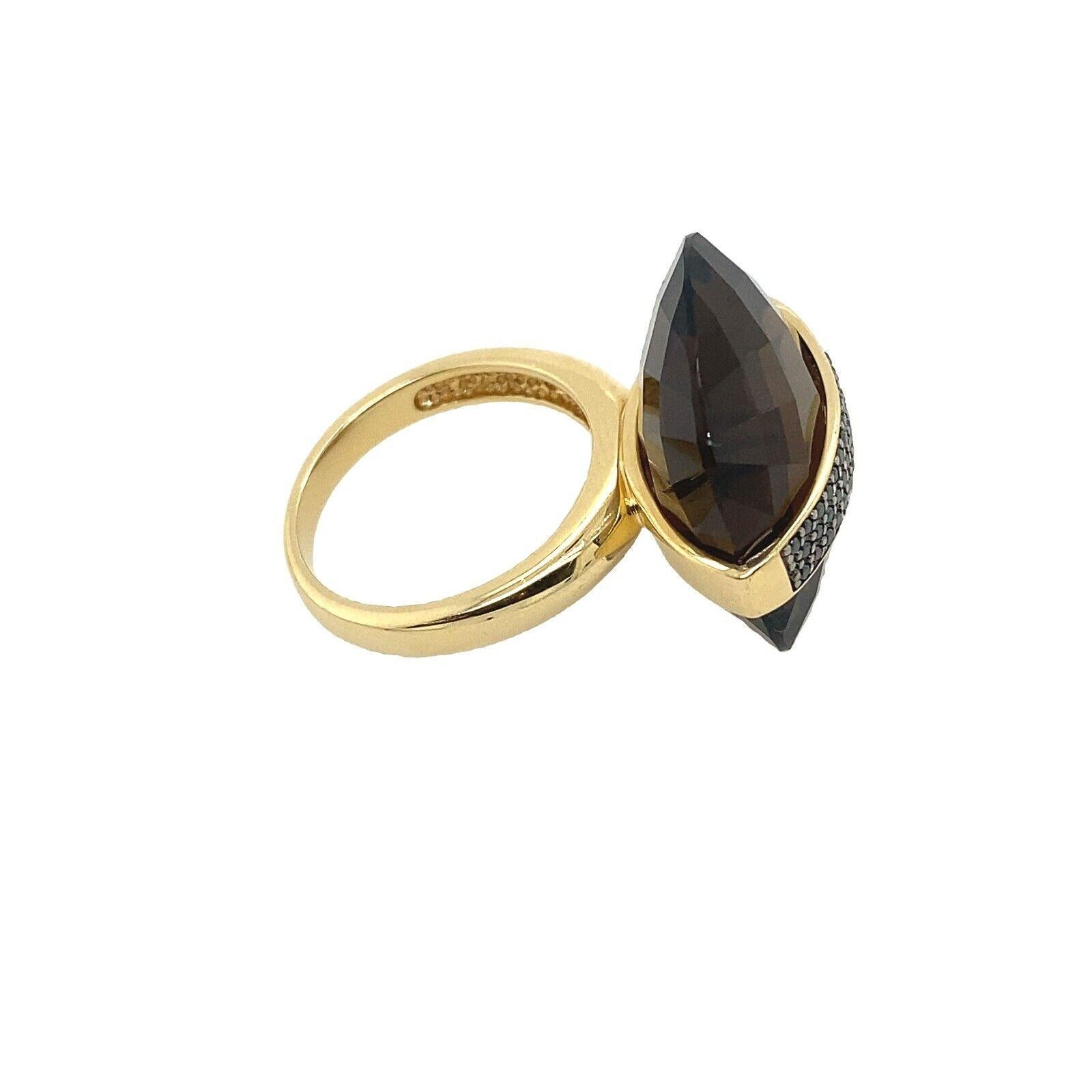 A delicate Smoky Quartz ring set in a 14ct yellow gold band. The Smoky Quartz is a beautiful stone that is translucent and has a very soft sheen, set with 0.50ct Black Diamonds. The stone is set in a delicate 14ct Yellow Gold band.

Additional