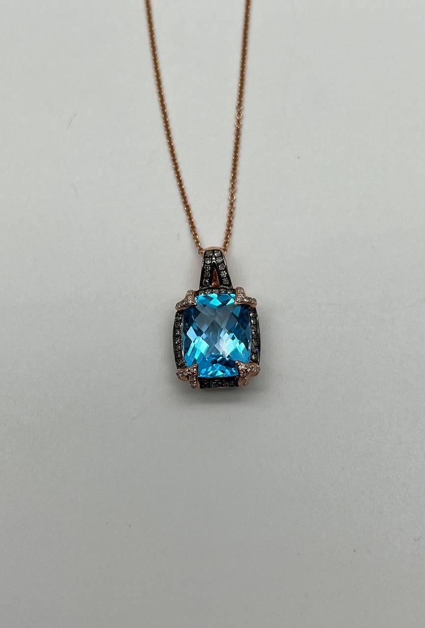 A captivating pendant necklace featuring a 6.8 carat cushion-cut Swiss blue topaz, set in 14k rose gold. Accented with 0.25 carats of champagne diamonds.
