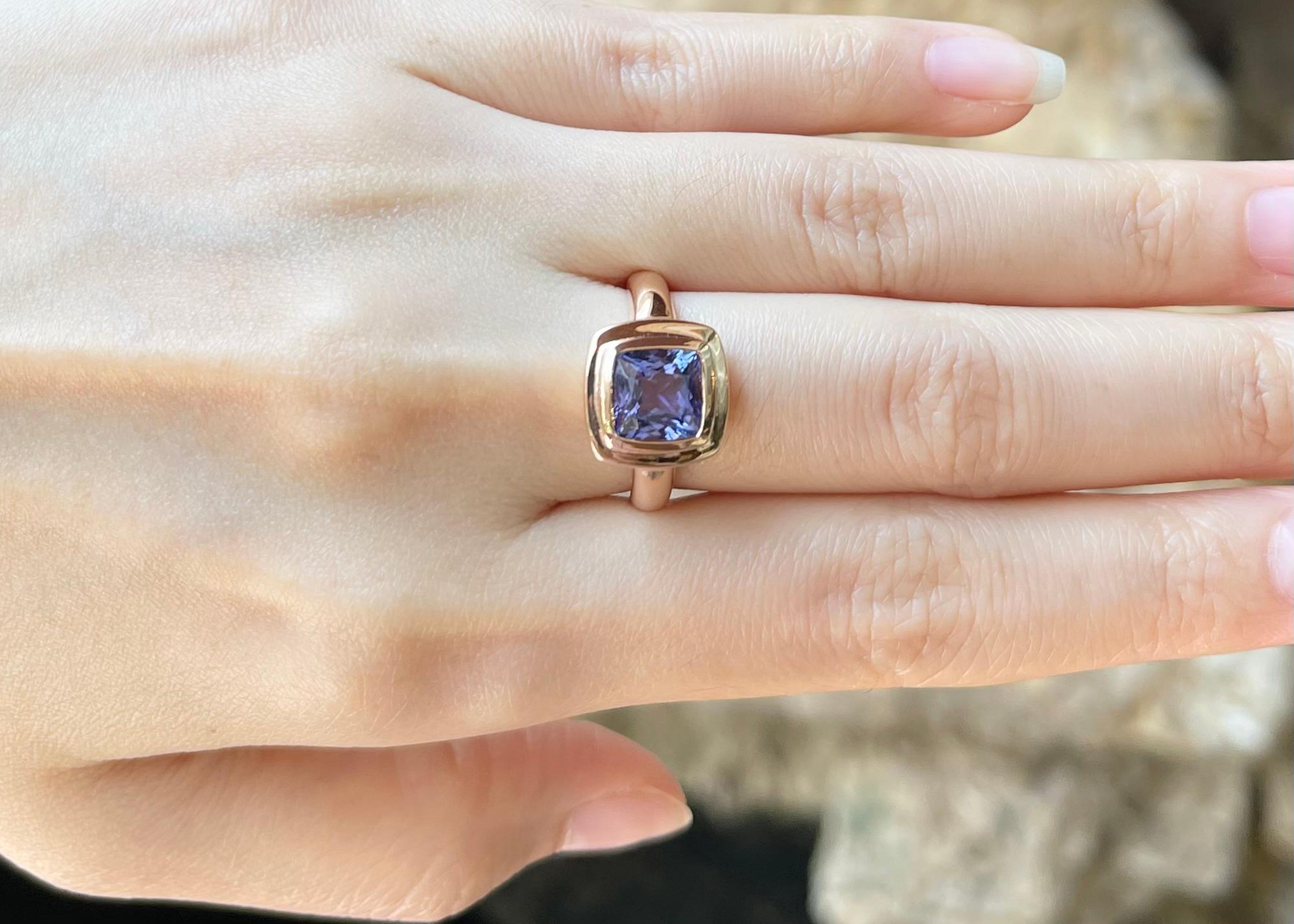 Contemporary Cushion Shape Tanzanite Ring set in 18K Rose Gold Settings For Sale