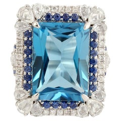 Cushion Shaped Blue Topaz Cocktail Ring Accented With Blue Sapphire & Diamonds