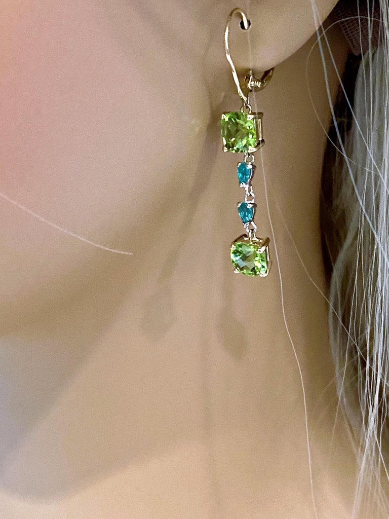 Contemporary Cushion Shaped Peridot and Pear Emeralds Gold Hoop Earrings Weighing 8.50 Carat For Sale