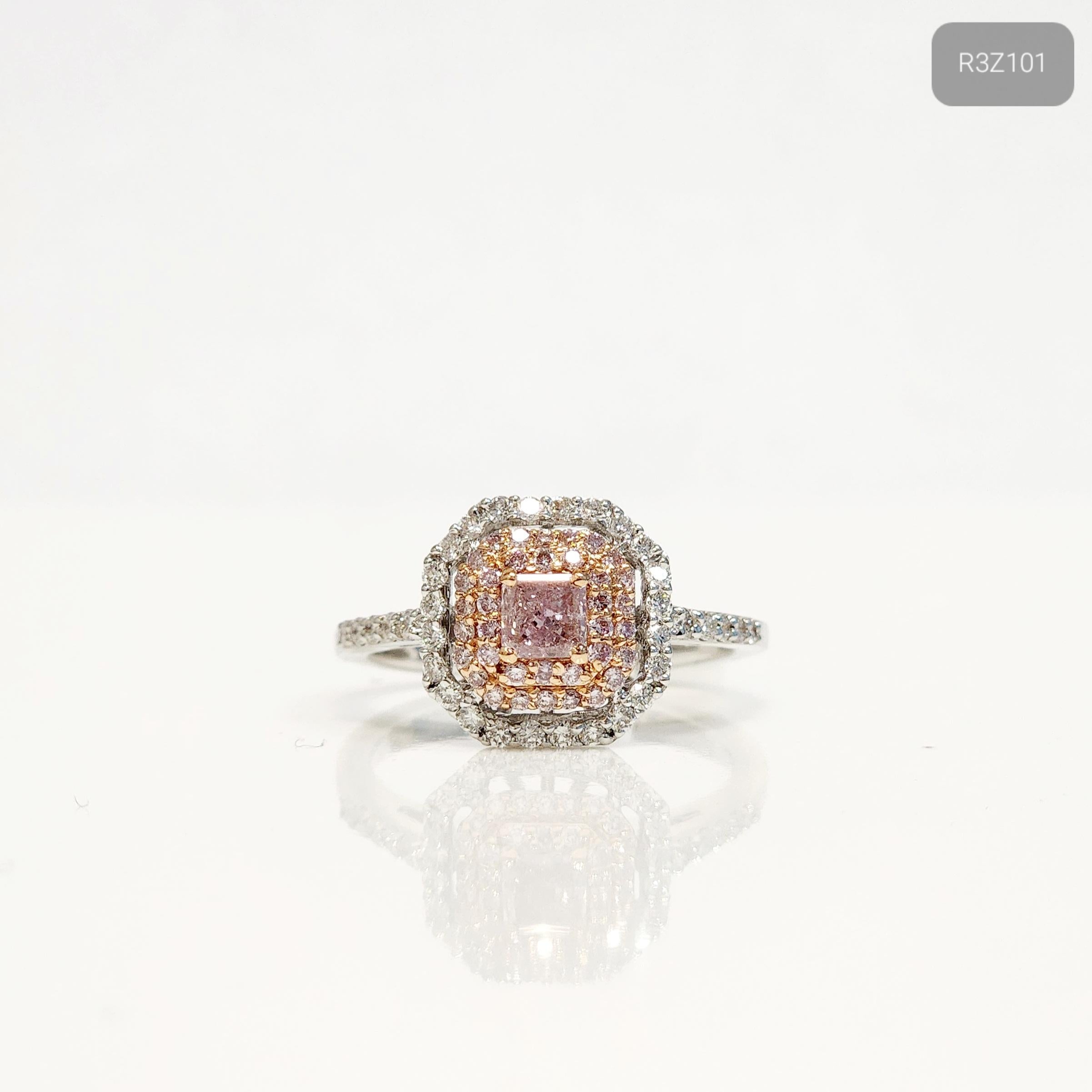 Radiate elegance and grace with our Cushion Shaped Pink Diamond Halo Ring. Featuring a captivating a 0.26 carat square cut pink diamond at its center, this ring is a true showstopper. A halo of shimmering 0.17 carat pink and 0.3 carat white melee