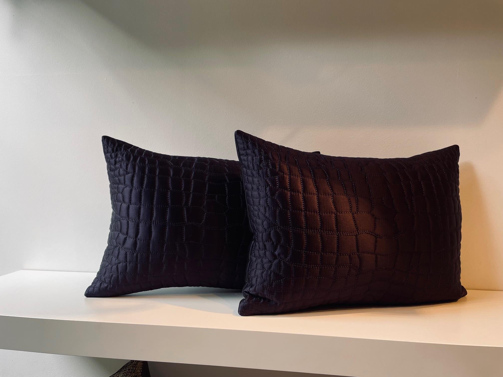 Pair of silk satin cushions, col. dark purple, hand quilted, Crocodile Skin Pattern at the front, plain silk satin at the back, cotton lining, concealed zip
Size 28 x 40cm
Feather inner pad.