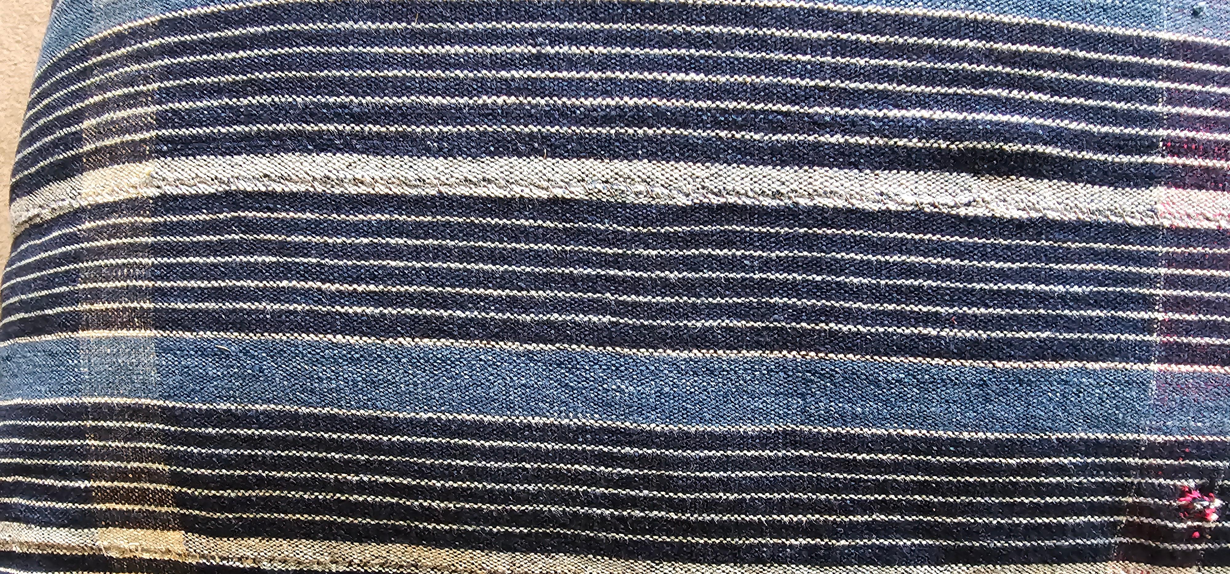 This is a very fine pair of Cushions hand sewn from a piece of Wedding textile from the Yoruba people of South West Nigeria . The original textile would have been hand woven from handspun  cotton and all natural indigo dyes . 
The Yoruba are fine
