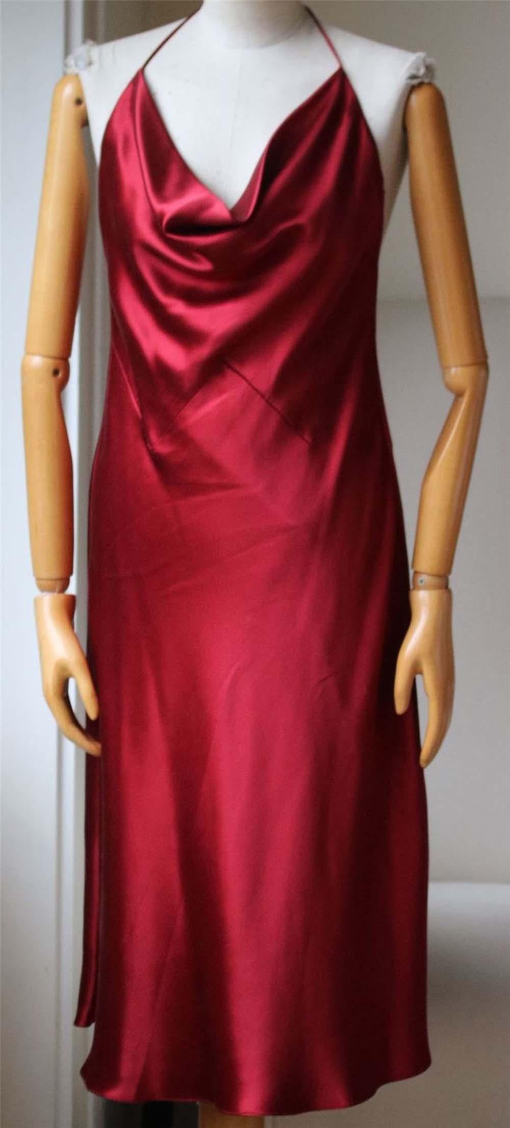 100% silk. Made in USA. Unlined. Draped fabric detail on front. Back tie accent at neck.

Size: US 6 (UK 10, FR 38, IT 42)

Condition: As new condition, no sign of wear. 