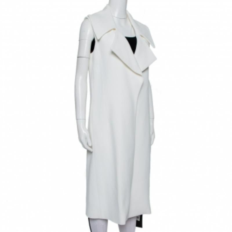 Minimal yet beautiful, this coat by Cushnie et Ochs is tailored into an open-front coat with a midi hemline. It will pair well with a dress or even over a simple top and jeans.