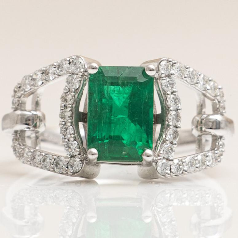 Here is a beautiful Brand New Custom Made 18k White Gold 1.88ct Panjshir Afghan Emerald And Diamond Cocktail Ring.

This ring features a 1.88ct natural earth mined emerald cut emerald measuring approx. 8.75mm x 6.00mm x 5.00mm. Emerald is moderately