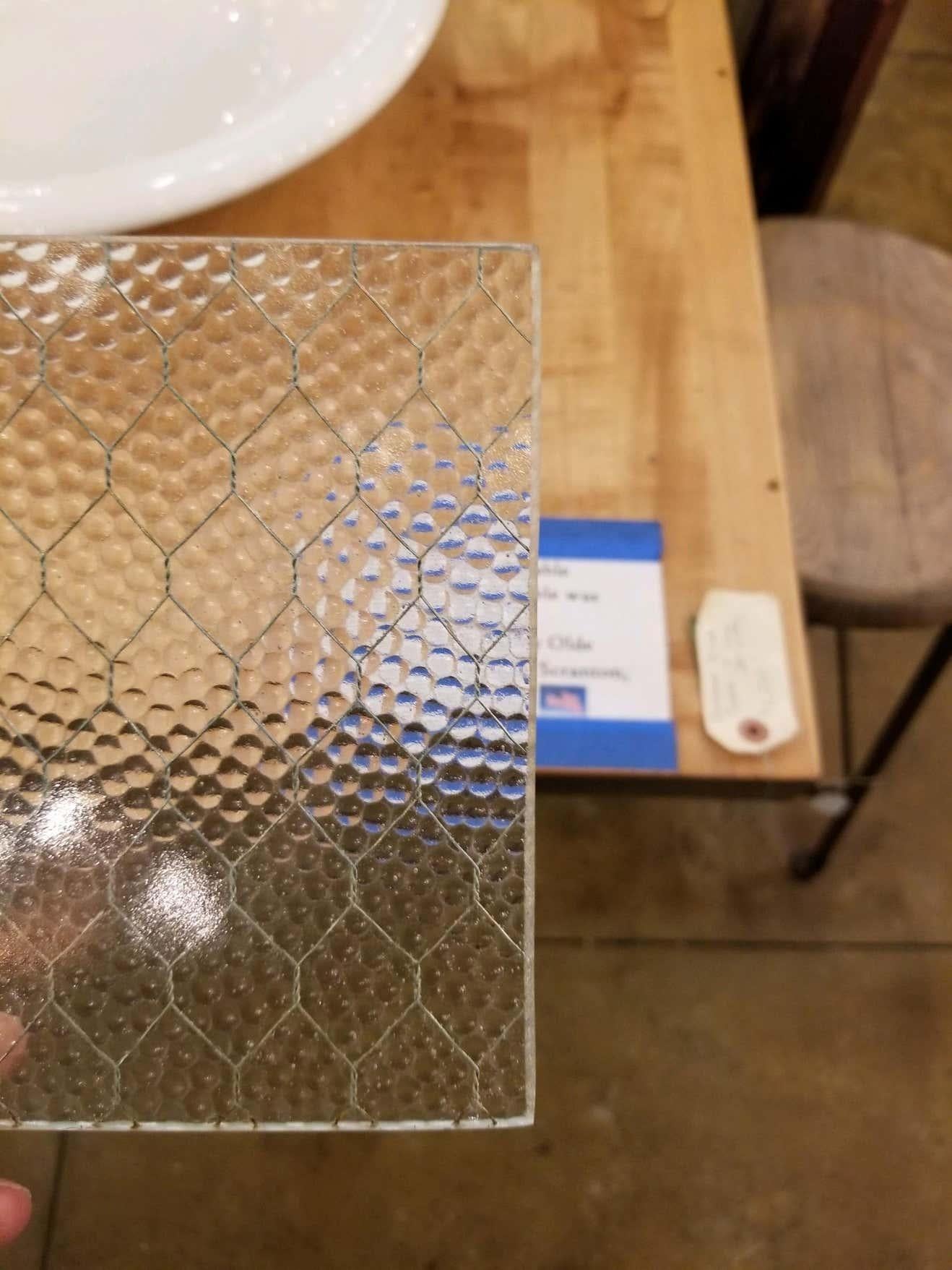 Two pieces for this pebbled chicken wire glass set. 14 inches x 40 7/8 inches x 1/4 inch. Bigger sizes available.

1920s 'Pebbled' vintage chicken wire glass. All of our chicken wire glass is salvaged from old factory windows and doors. Sizes may