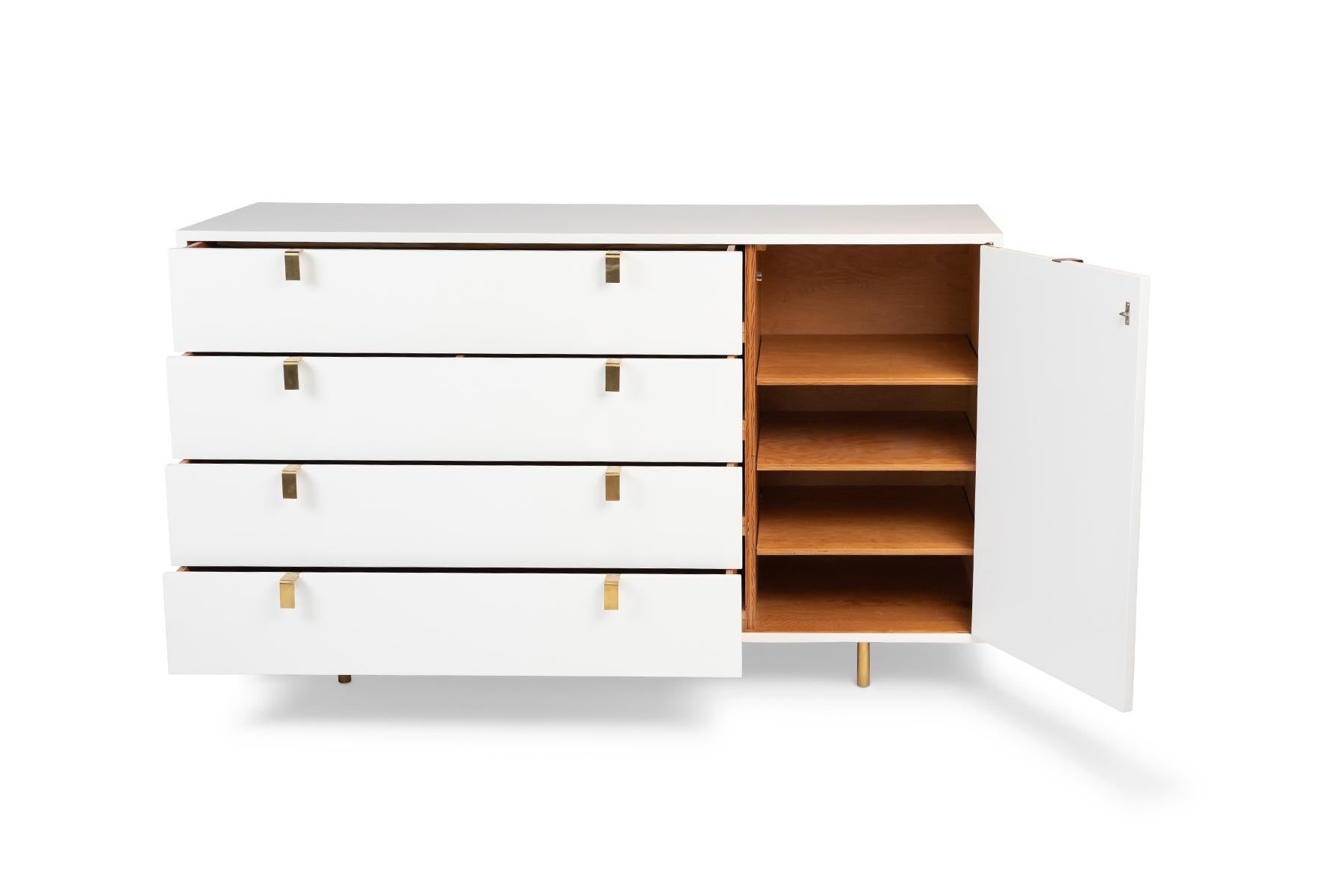 White lacquered chest of drawers with solid brass drawer pulls and legs, circa late 1940's. This example has been newly and impeccably refinished.