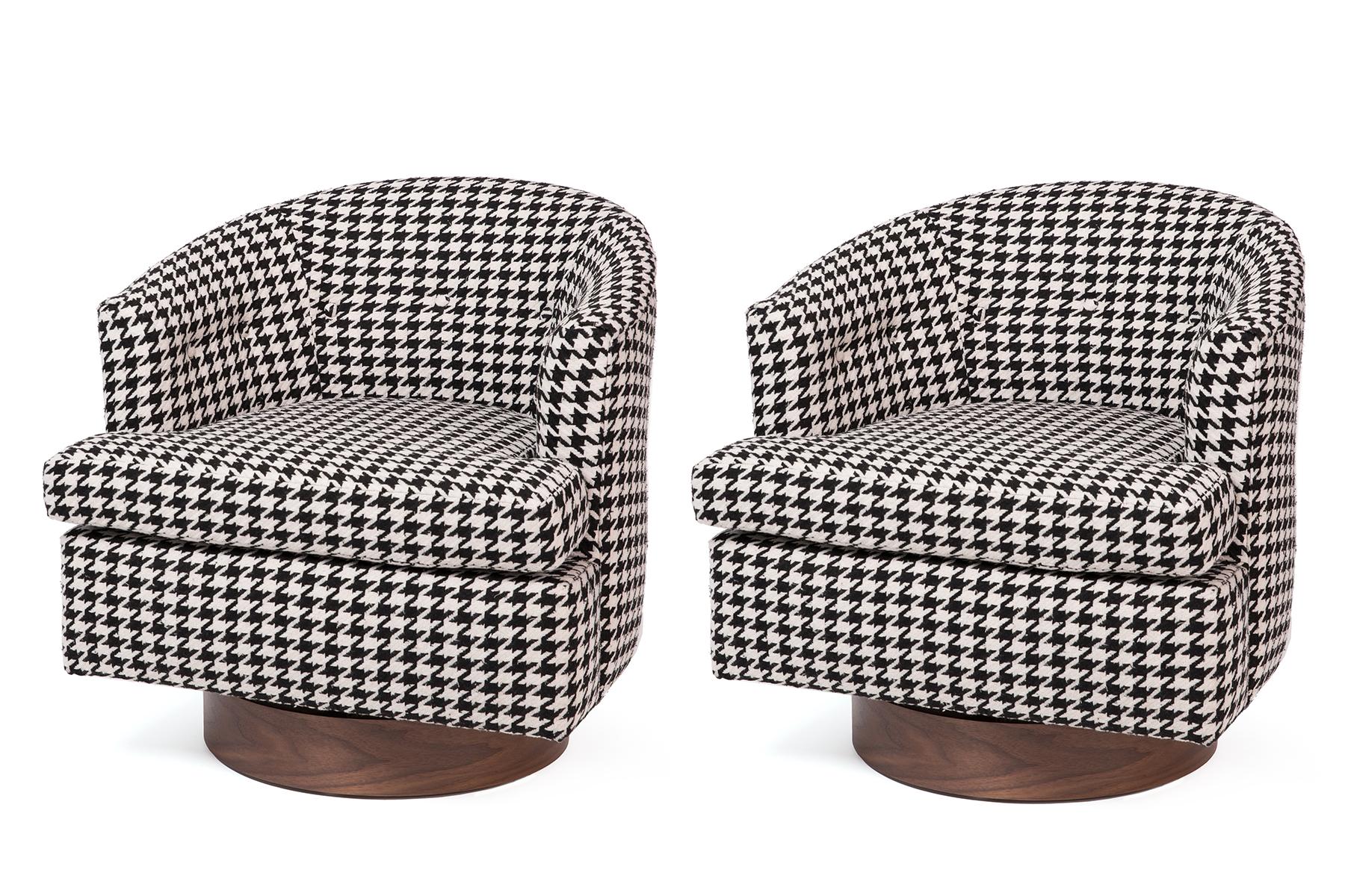 Add a delightful pop of graphic black and white patterning to your interior with these custom 1960s houndstooth swivel lounge chairs with solid walnut bases. Chairs have been newly upholstered and finished.
