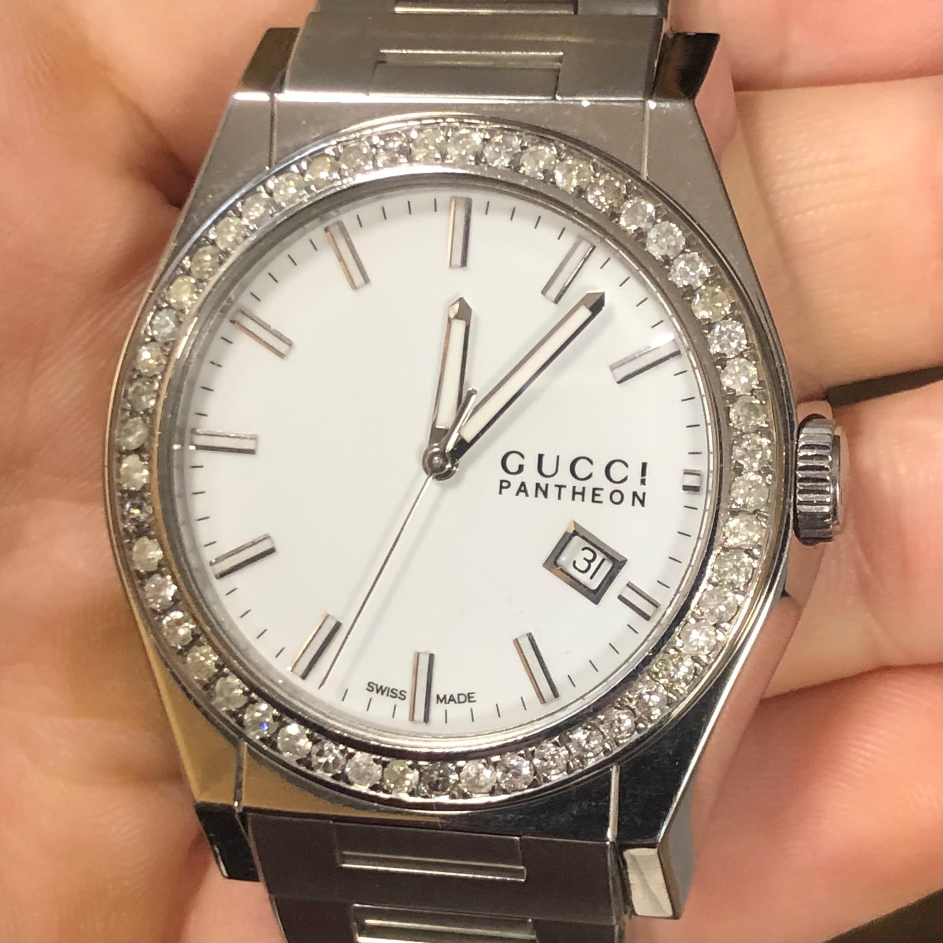 Custom Diamond Gucci Men's Pantheon Watch with box and booklet papers.

Original Gucci Bezel customized hand-set with approx. 2.00 carats of natural genuine earth-mined SI-I Diamonds. The diamonds shine beautifully in the light.

Custom Gucci Men’s