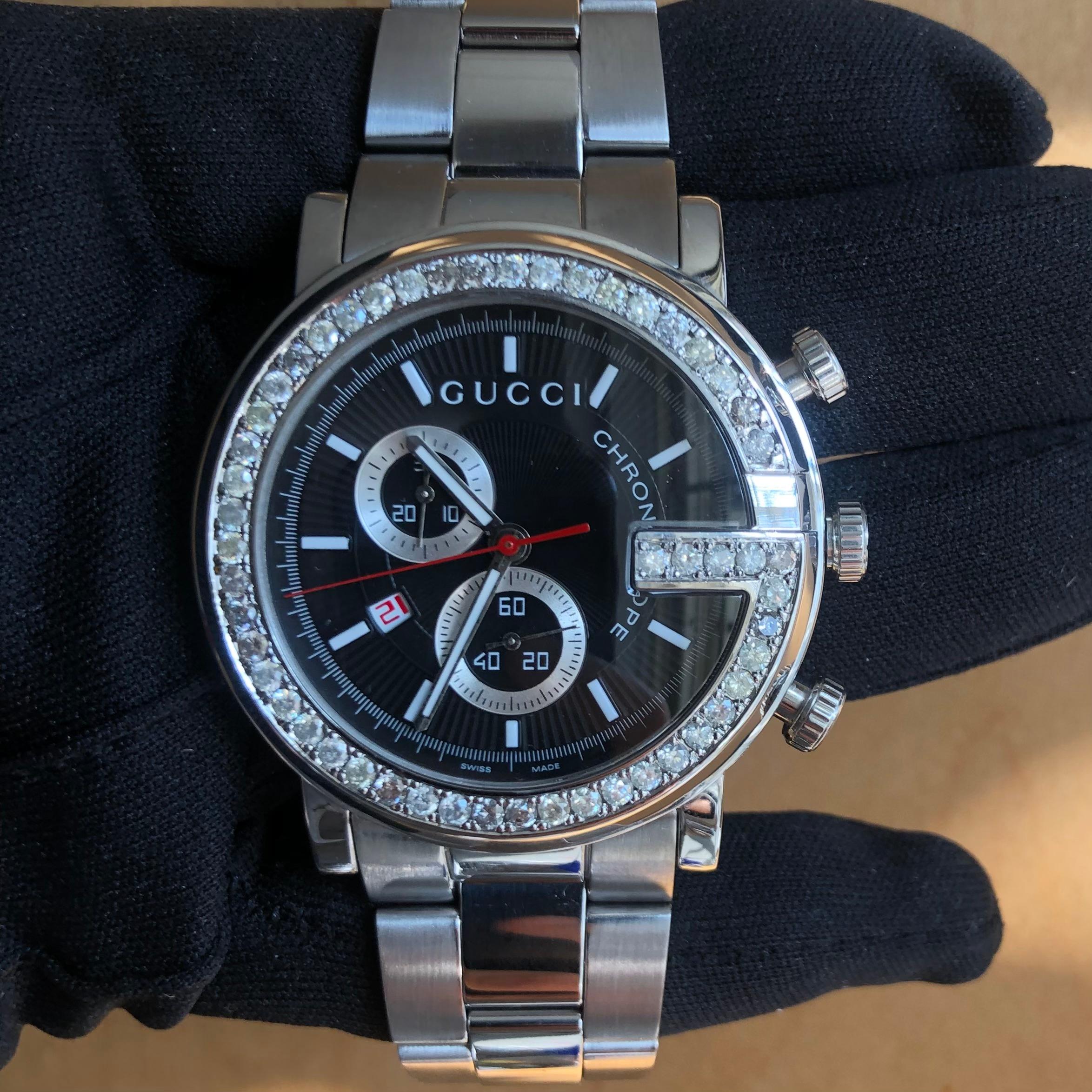 Custom Diamond Gucci 101M G Chrono Swiss Made Black-dial 44mm Watch with box and booklet papers.

Original Gucci Bezel customized hand-set with approx. 3.00 carats of natural genuine earth-mined SI-I Diamonds. The diamonds shine beautifully in the