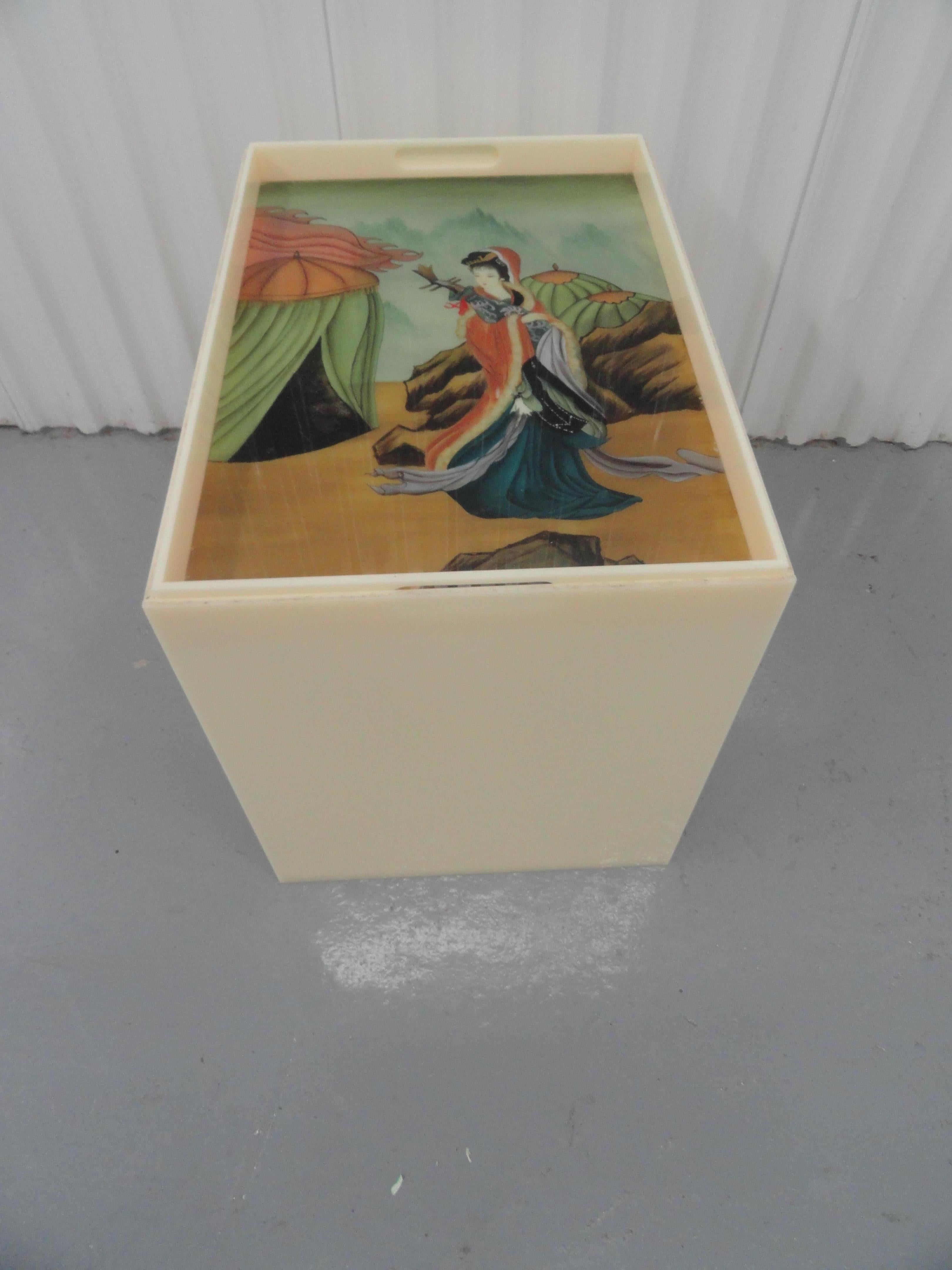Custom acrylic table with removable top. The top contains an inserted piece of reverse glass painted art of an Asian female figure.