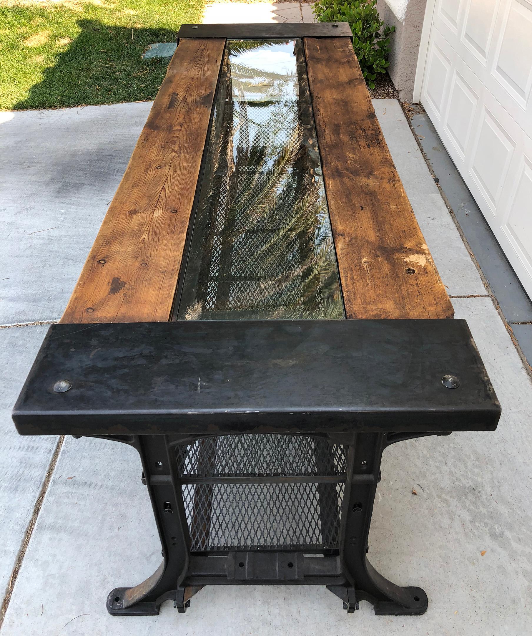 Available right now we have this gorgeous industrial modern dining table, with glass insert or middle. This table was custom designed and manufactured for AllSaints and was used in one of their retail stores as a shelving display for clothing.

This