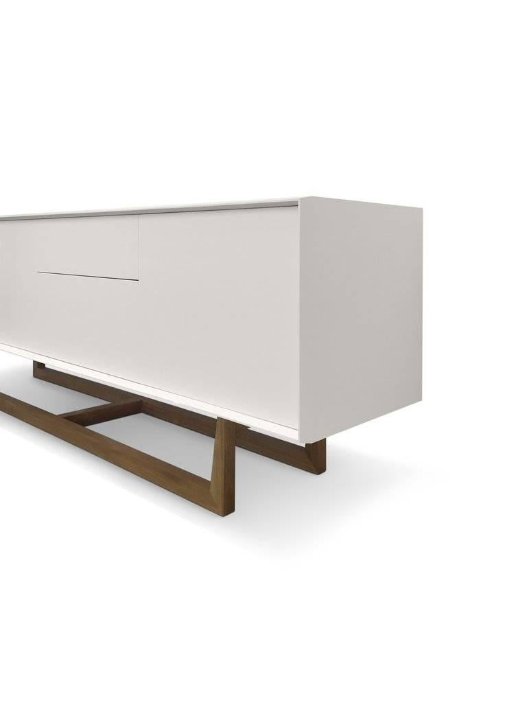 The Altone design 'Walker' custom-made sideboard is handcrafted in Australia. The Walker is composed of three doors and two-drawer construction. The materials used in the design are two-pack soft white cabinet with a leg structure in sold Australian