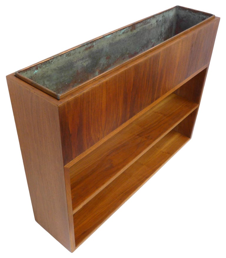 A wonderful mahogany and copper custom made shelving unit and planter. Reminiscent of Gilbert Rhode designs for Herman Miller. Wonderfully well built and in exceptional vintage condition. A classic example of minimalist, chic, utilitarian American