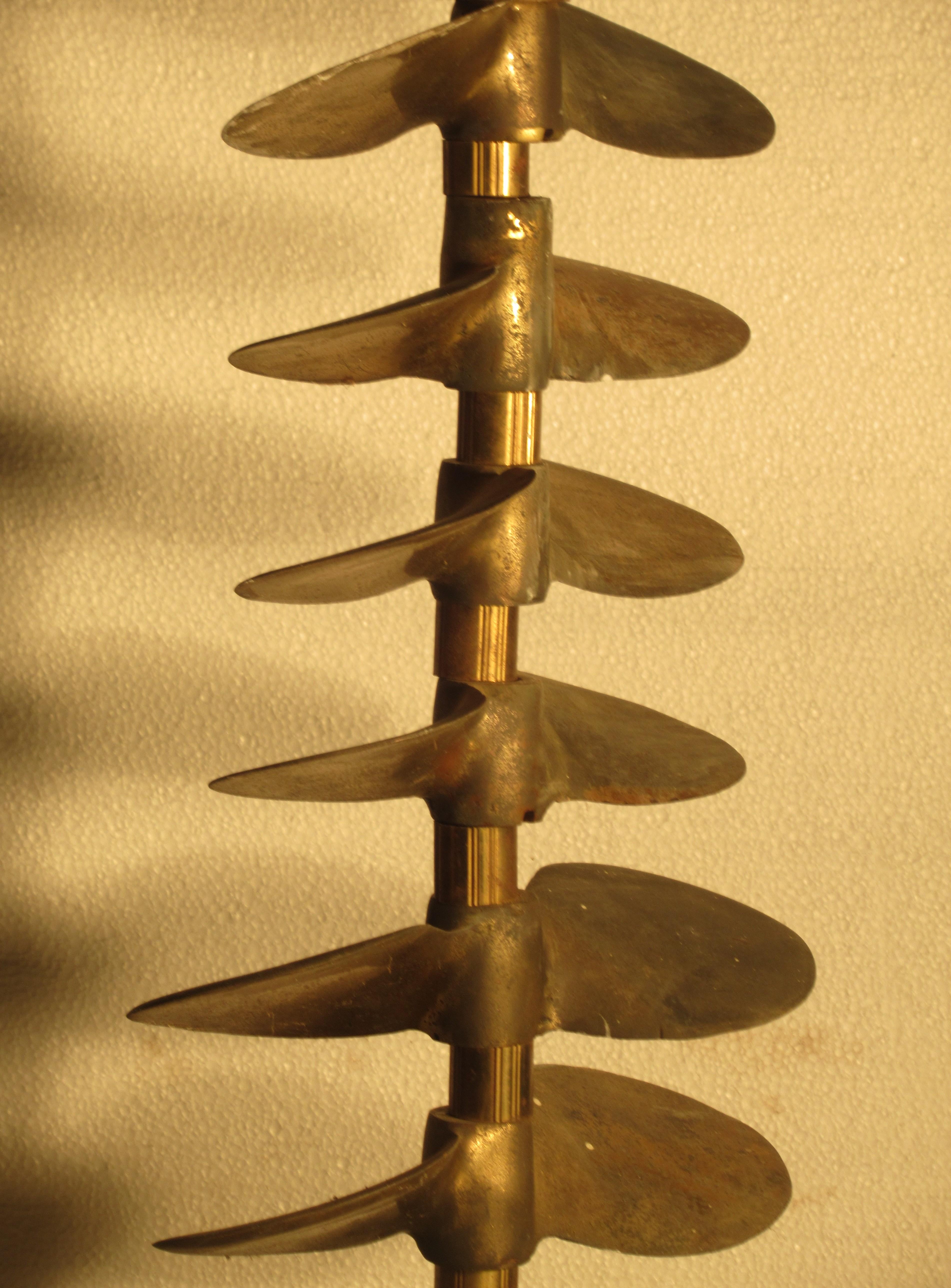  Antique custom made nautical theme lamp constructed of seven tiered bronze propellers mounted on a shaft with a bronze, wood and glass porthole base. This is not a newly repurposed item, it is an old lamp and dates anywhere from 1920 - 1940. Height