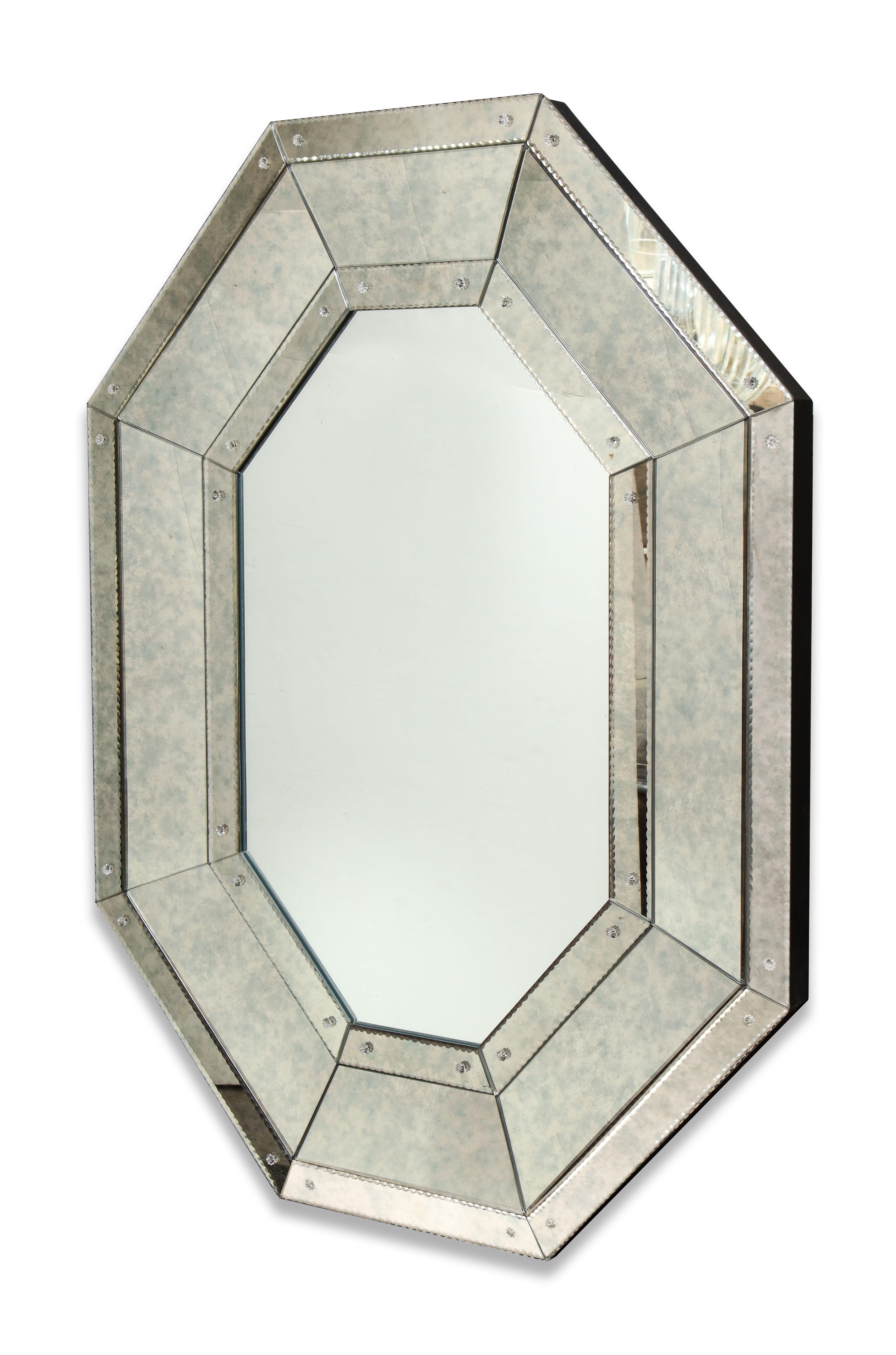 Beautiful custom octagon mirror with pie crust edges and glass rosettes. The mirror shown here has clear finish in the center and Hade antique finish on the perimeter. Custom orders are available for different sizes, shapes and mirror finishes.
