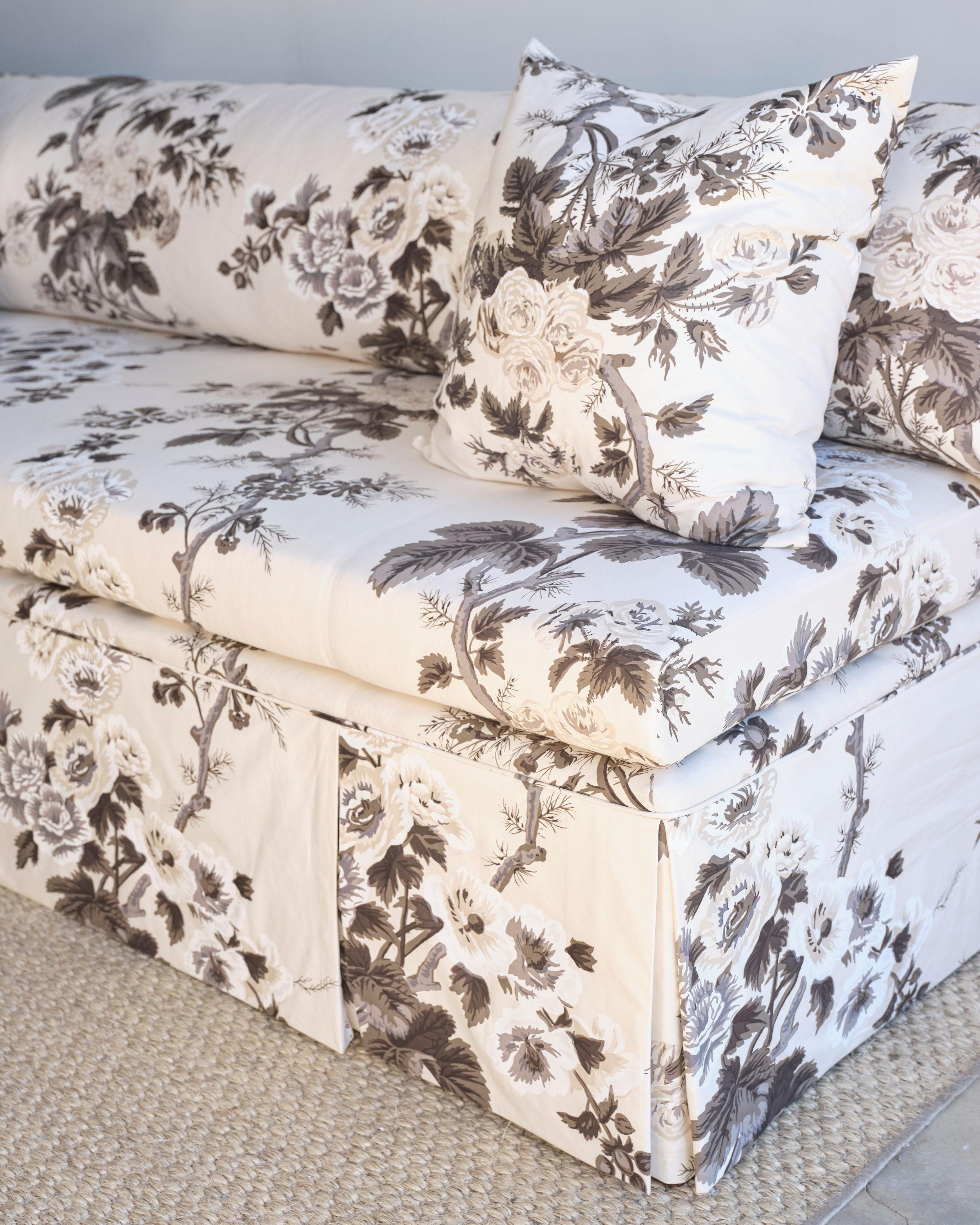 This beautiful custom armless sofa was built by a local Jackson, Mississippi upholsterer about a year ago. It is new and has never been used. It is covered in Schumacher Fabric: Pynne Hollyhock/ Charcoal that has been sprayed with Fibregaurd. It has