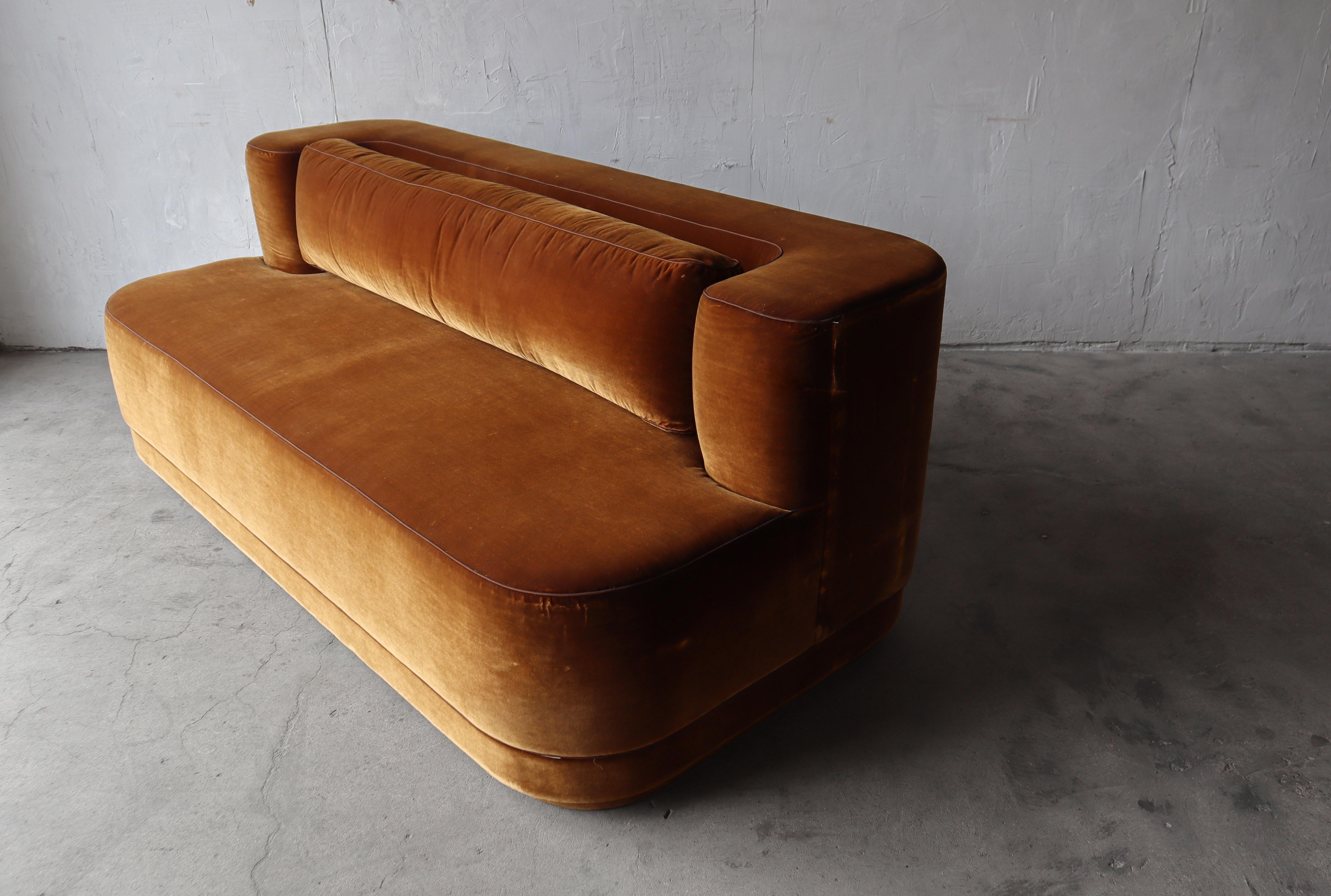 Incredible custom sofa.  The curved lines and overall shape of this sofa are truly eye catching.   We love the triple tiered base, the chunky curved backrest and the oversized, weighty, all down bolster pillow.  

We have 2 available.

These sofas
