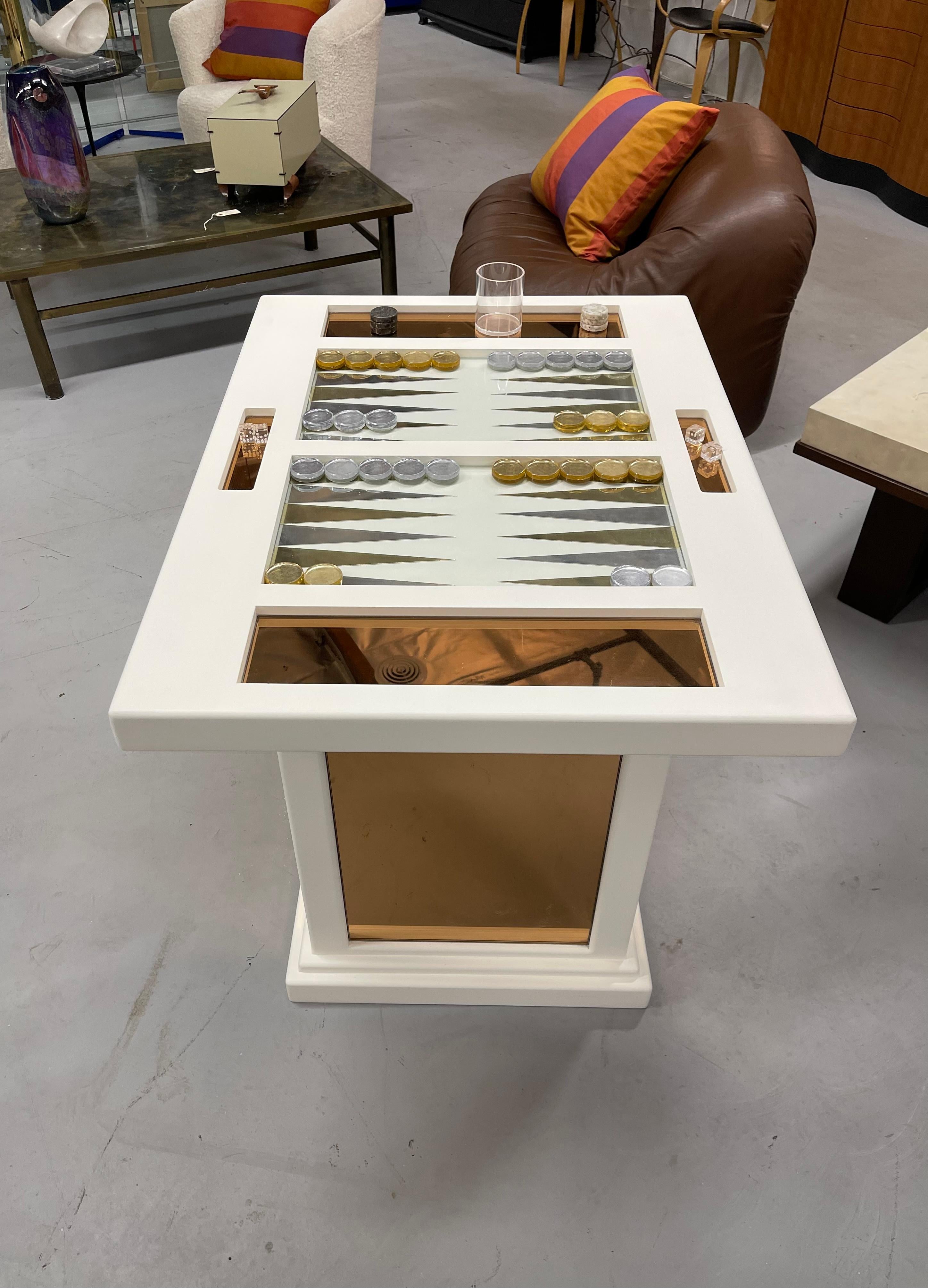 Beautiful custom Backgammon game table. We just has this repainted. Mirrored panels inlayed in the sides and on the top in a rose color. Vintage acrylic backgammon pieces and dice. One corner has some scratches from handling, see photo.  Acrylic