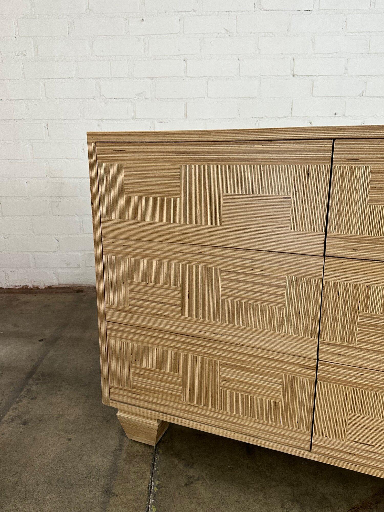 W64.5 D20 H33.25

Handmade in house for a custom staging project this one a kind dresser features patchwork Baltic birch trim. Push drawers to avoid hardware and deep ample drawers. Dresser shows in excellent condition fabricated and used for