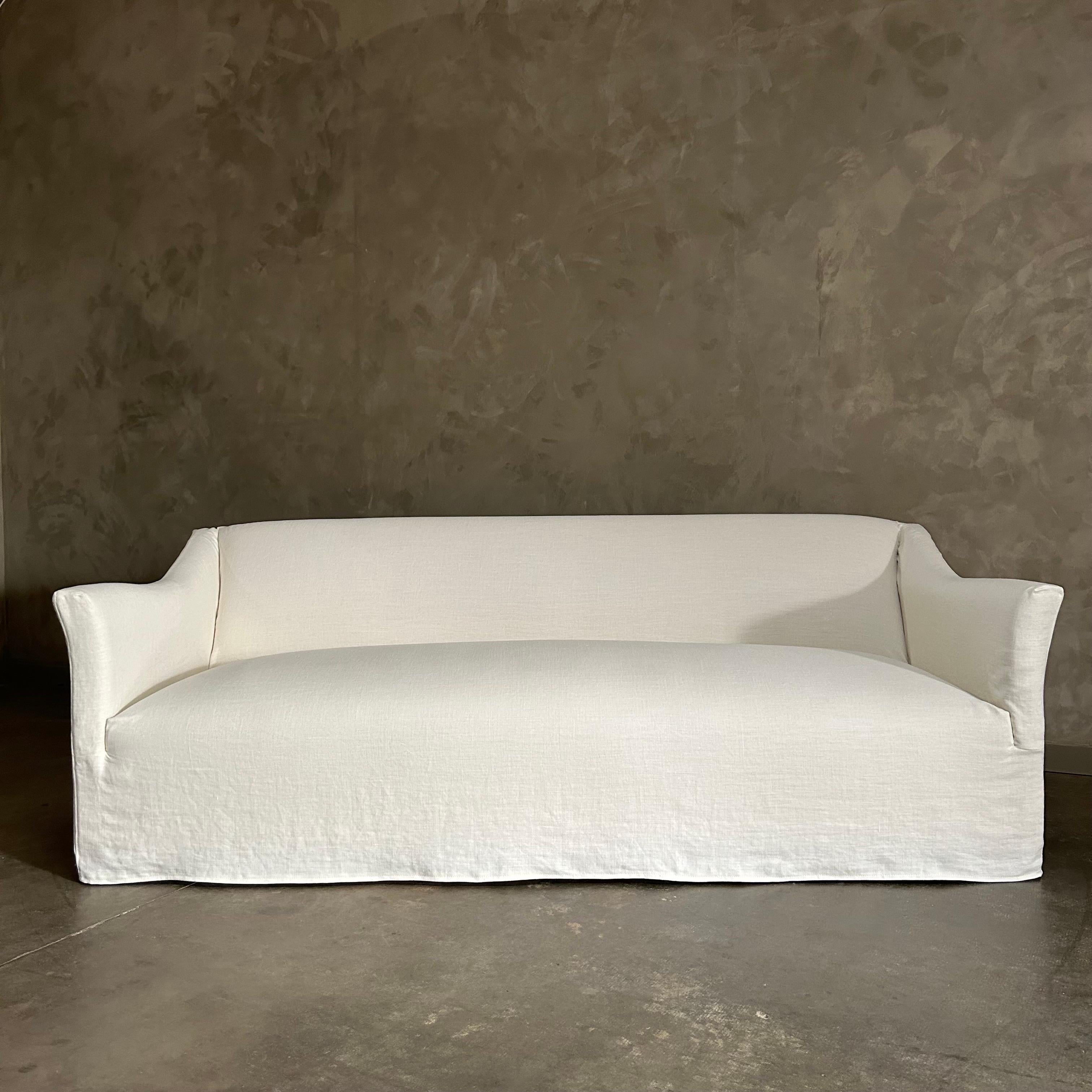 BH Bespoke Collection
Olivier Sofa Slip Covered
Shown in Heavy Oyster White Belgian Linen
DESCRIPTION:
A timeless silhouette with tailored lines and softly flared arms, the Olivier Sofa is a relaxed yet refined classic that will be a lovely addition