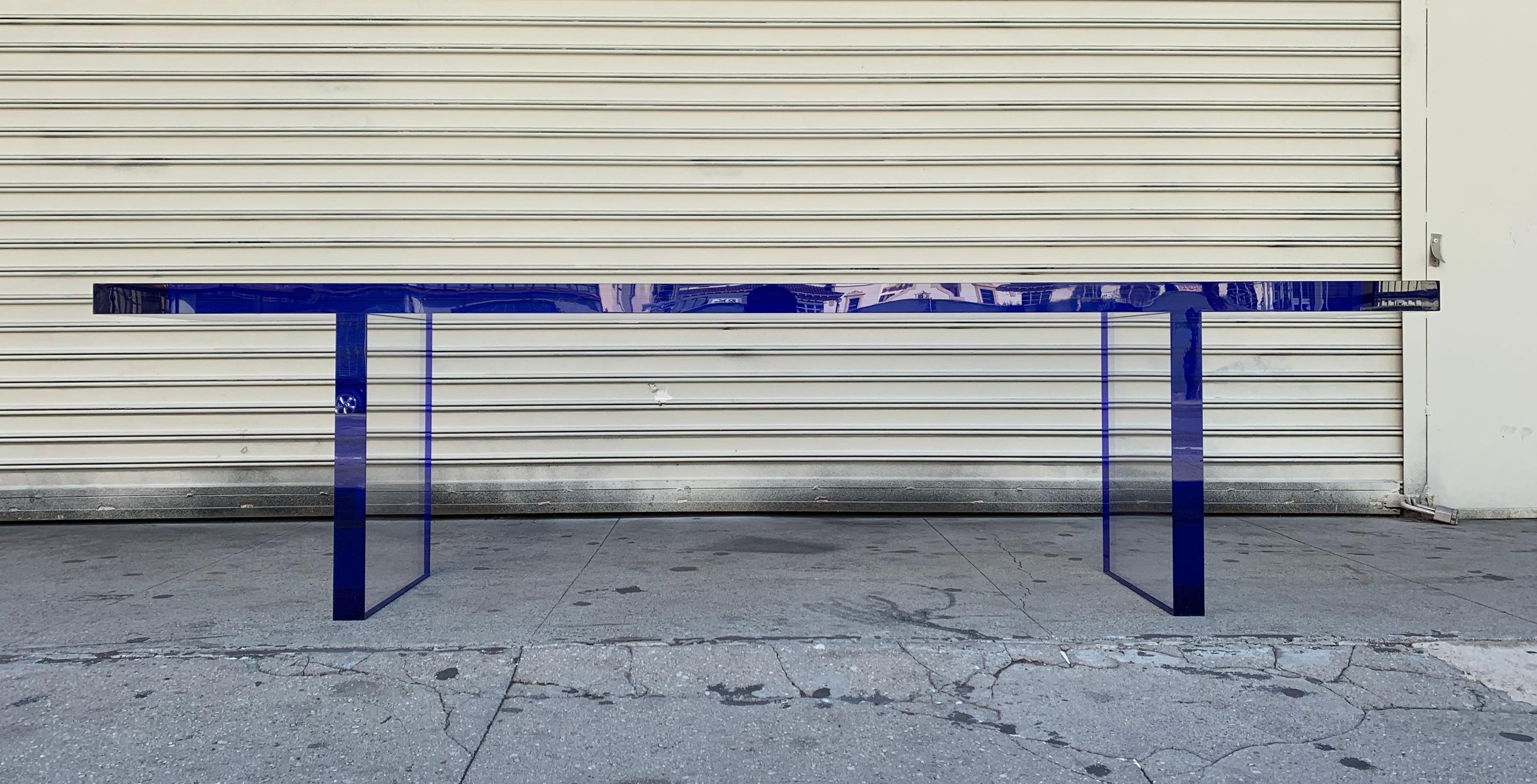 Introducing the Cobalt blue & Clear Lucite Bench by Amparo Calderon Tapia, a stunning addition to any contemporary living space. Crafted from high-quality Lucite material.
This bench is handcrafted using a 2 inches thick clear Lucite and Cobalt Blue