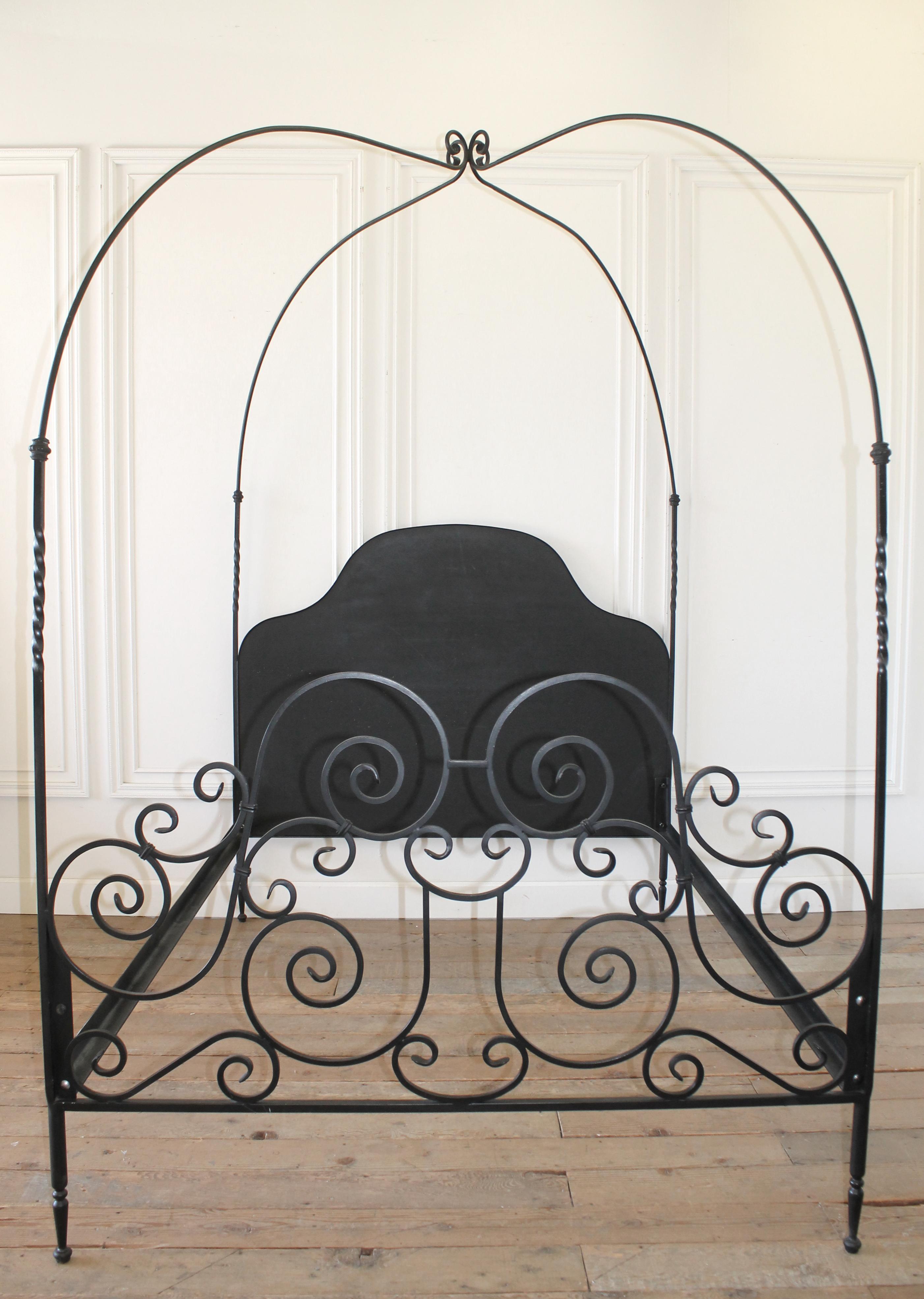 Custom black iron queen size canopy bed
The headboard is wood in the center of the iron frame that can be upholstered for a more custom decorative look.
The bed comes apart as a headboard, footboard, 2 side rails, and canopy.
Very solid and