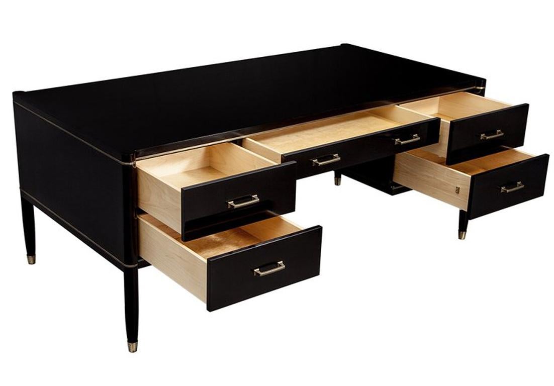 This is a custom hand crafted desk that is not a production piece. It is only made to order and is made from bespoke materials designed just for this one piece. Solid maple drawers with self-closing mechanisms, solid brass custom made drawer pulls