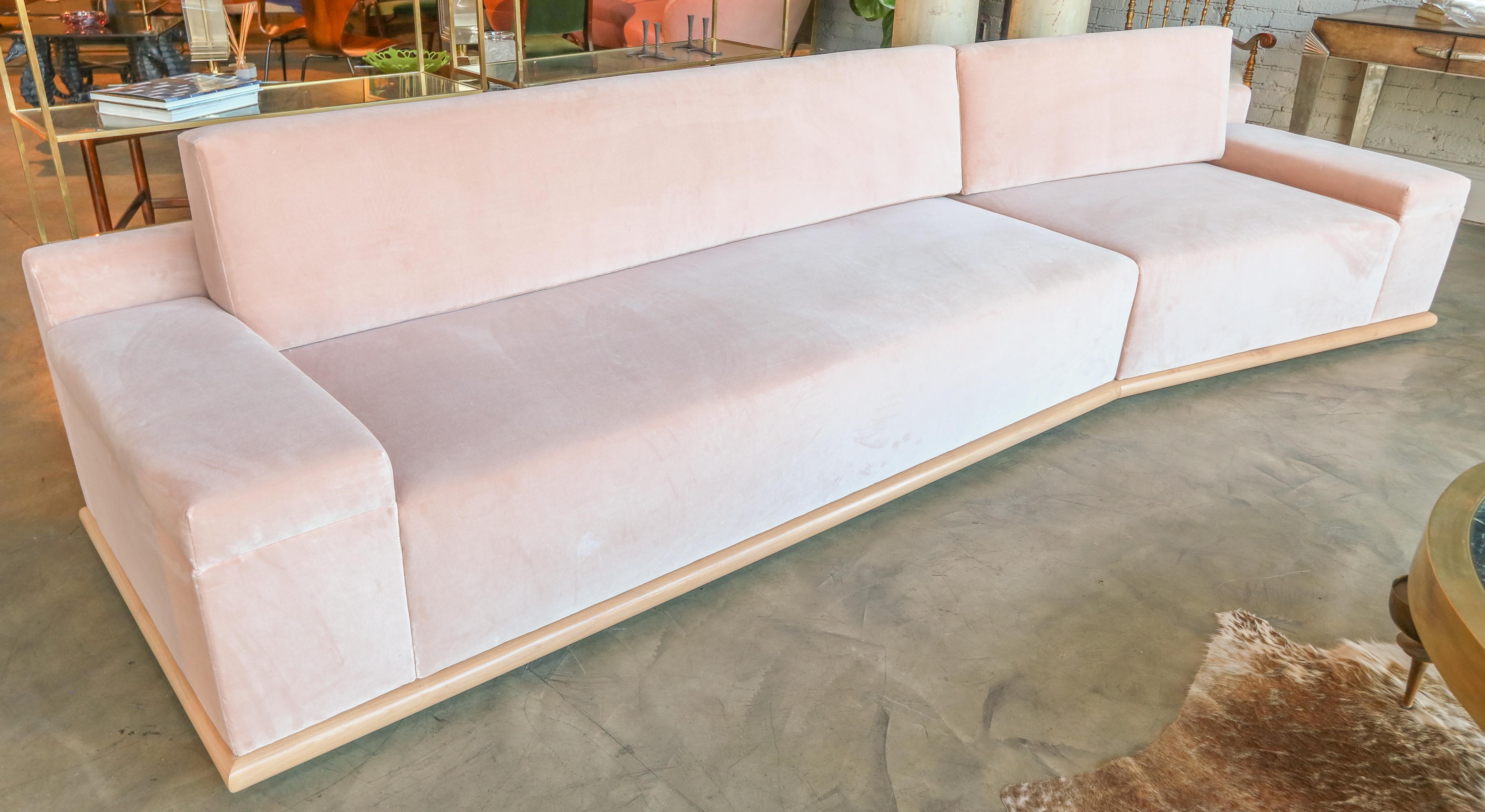 Custom midcentury style sectional sofa in plush velvet in blush pink with maple wood base.  Made in Los Angeles by Adesso Imports. Can be done in different sizes, colors and fabrics.

Measures: Large section 83