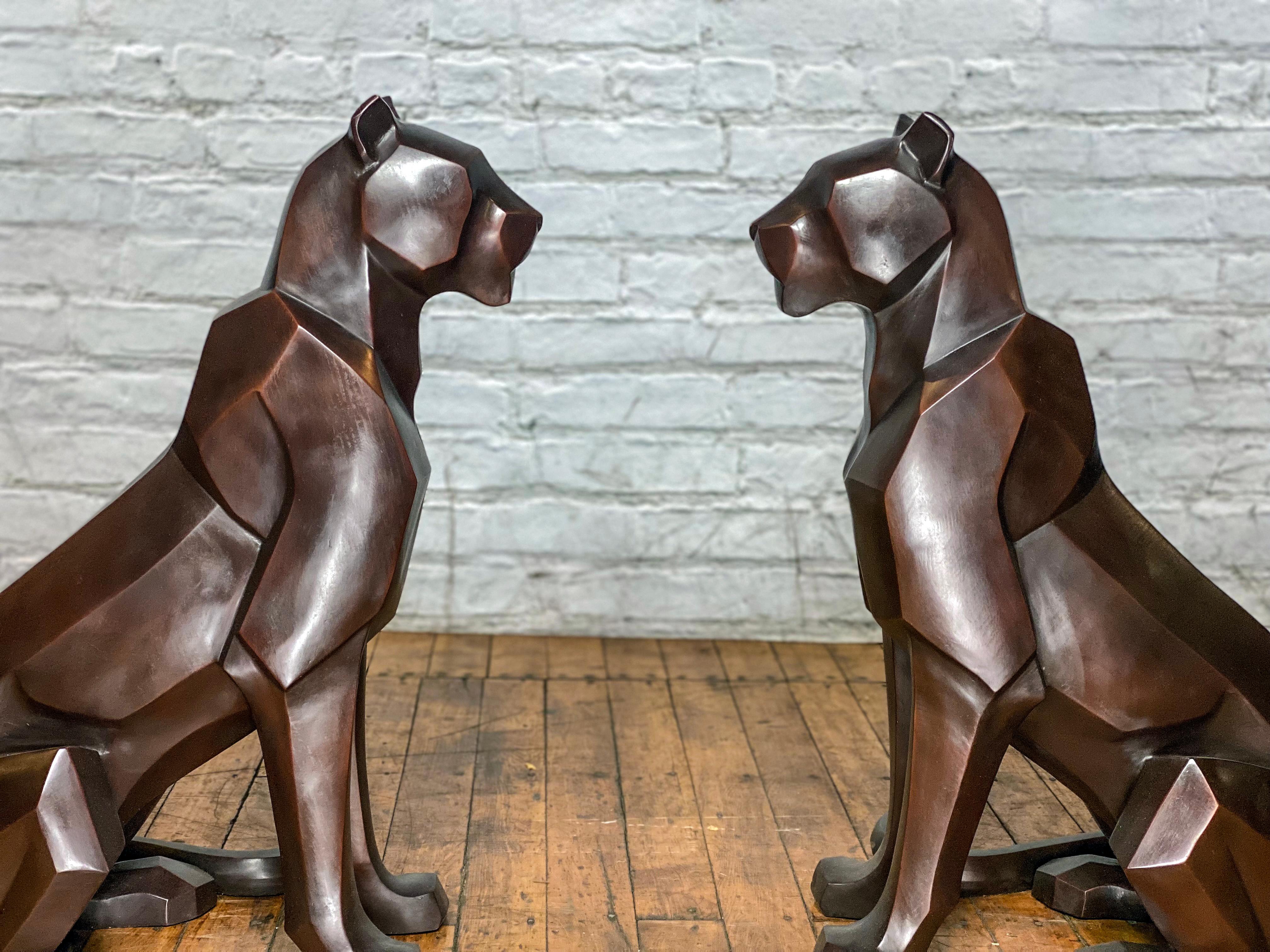 A stunning and modern addition to our bronze animals collection, our pair of lost-wax bronze mountain lion statues. These eye-catching bronze mountain lion statues are designed and cast from an original custom mold featuring unique abstract