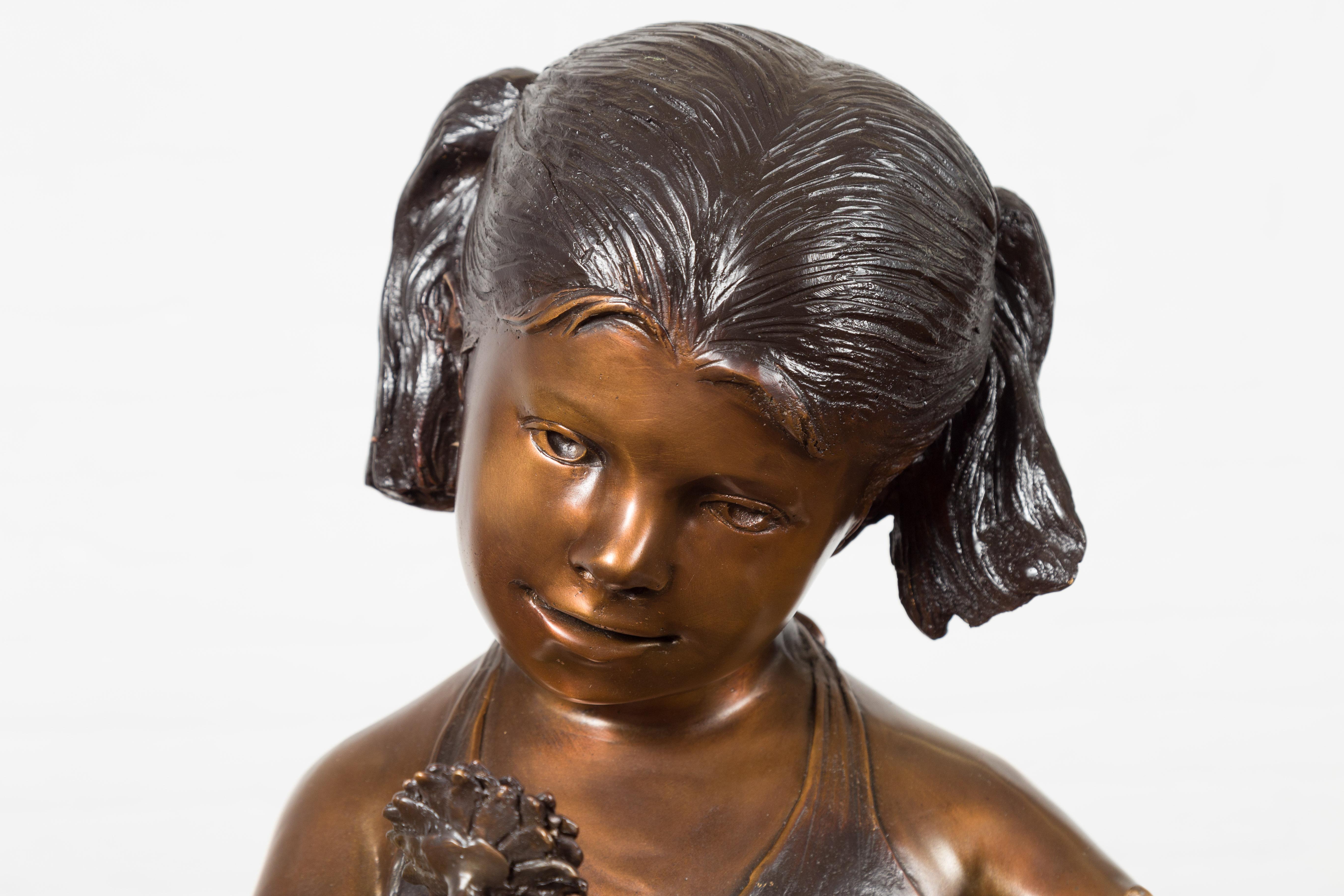 Contemporary Bronze Garden Statue of a Girl Holding a Flower in Her Hand on Base For Sale