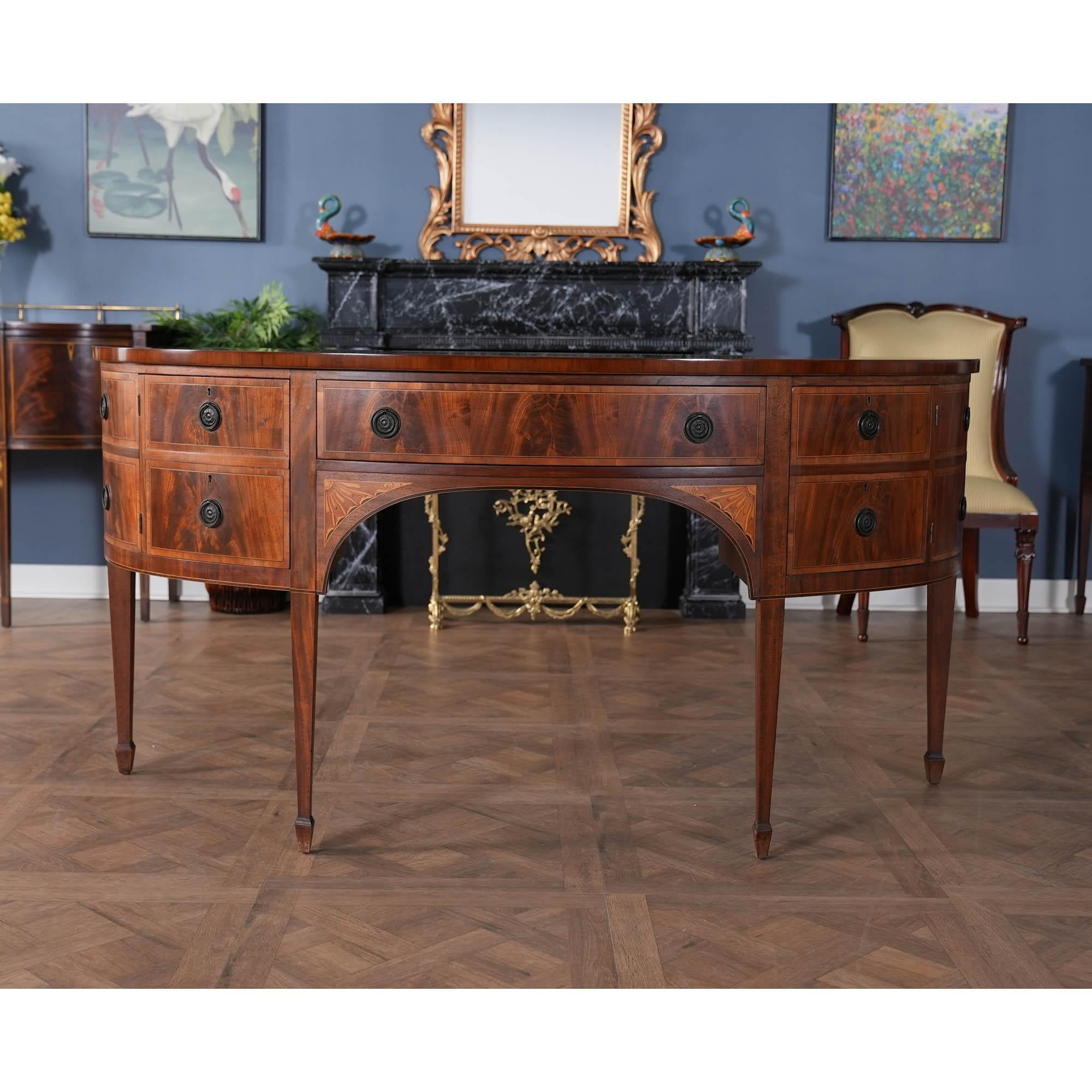 The absolute highest quality piece of cabinet making is exemplified in this Custom Built Mahogany Demi Lune Sideboard. From the recently French polished top to the base of this cabinet all of the components work together to create a simple yet