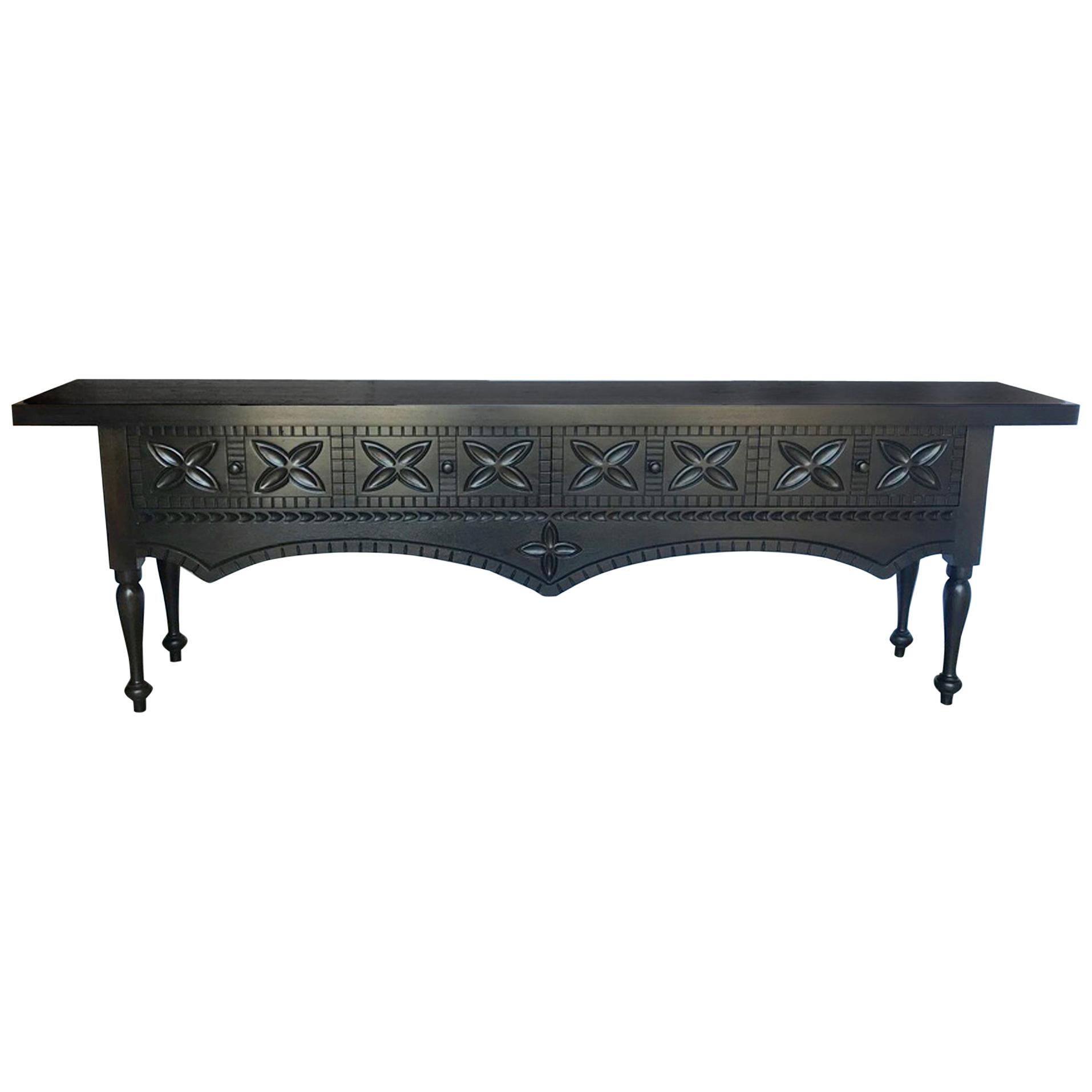This custom carved Nahuala console is based on indigenous Guatemalan tables. The word Nahual means animal spirit. This particular one has four drawers and was made in Walnut with a closed grab, dark finish, no distress.
This console can be made in