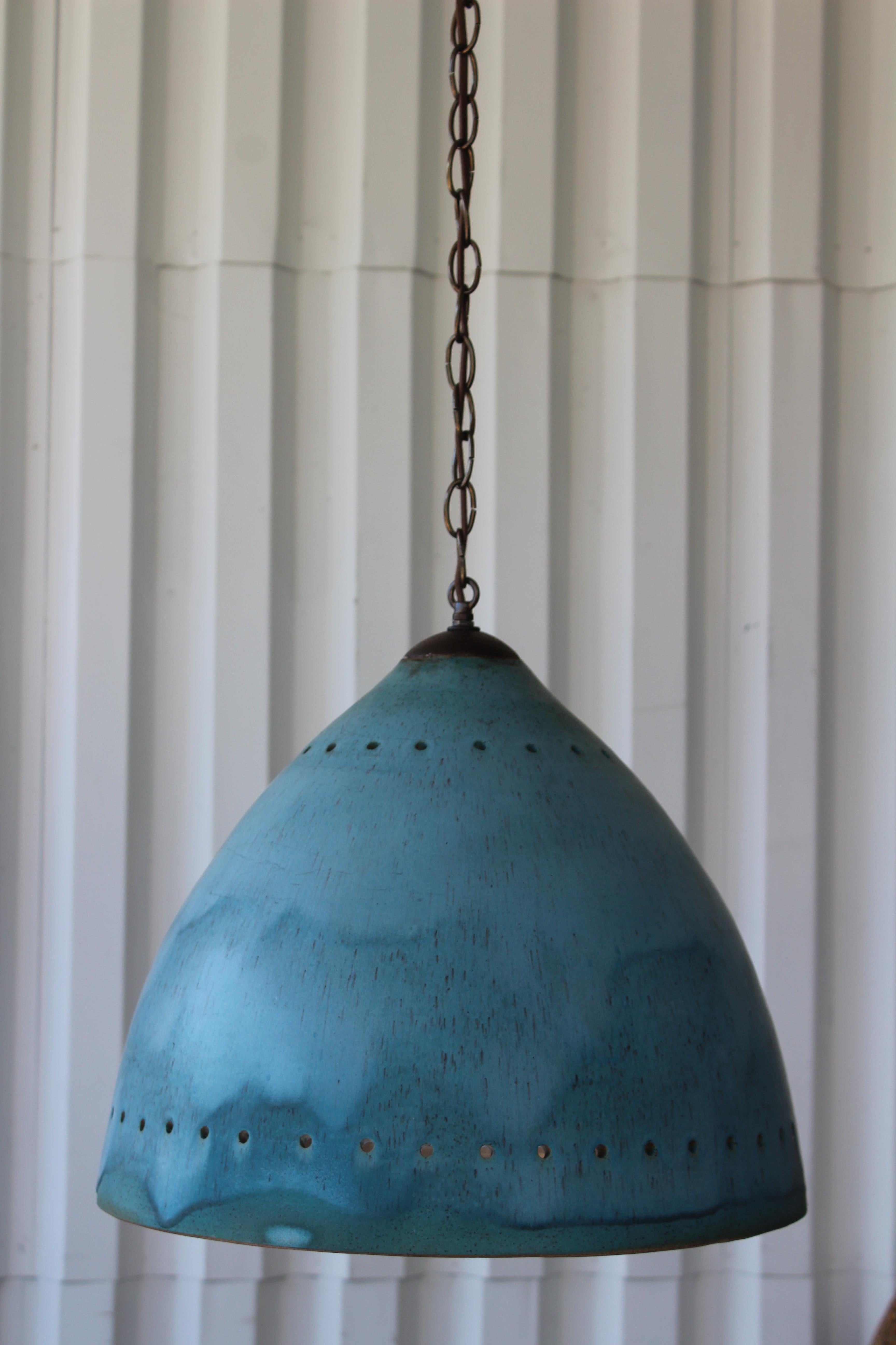 Custom made glazed ceramic pentant lights by California ceramicist Natan Moss. Newly rewired, includes 6 foot brass chain. We have 4 available, each sold individually. They are in a brilliant blue glaze and a glossy off white interior glaze. Please