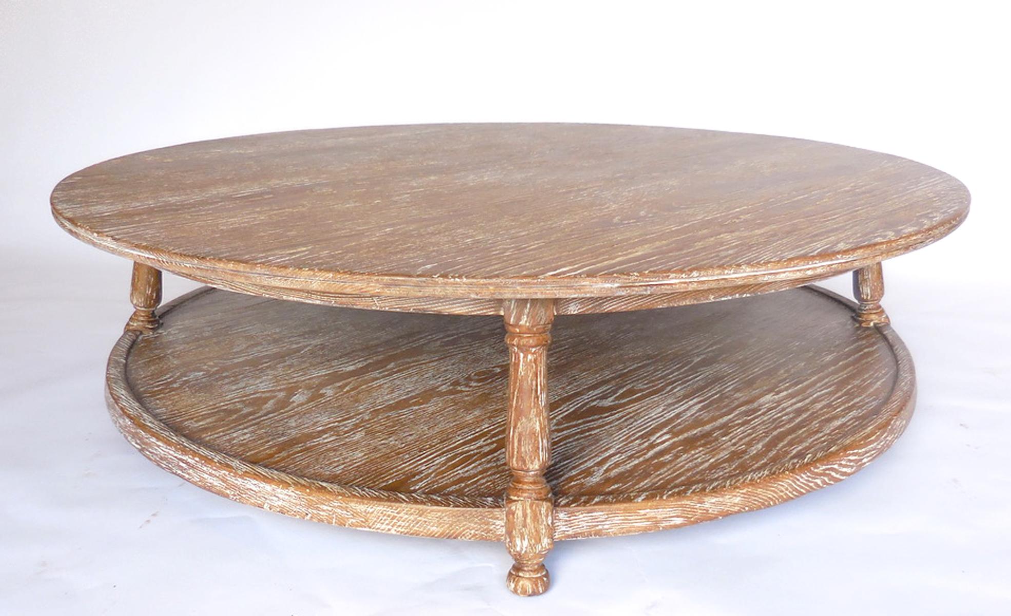 This custom coffee table with shelf can be made in oak, mahogany or walnut in a range of finishes. Bench made and hand finished in Los Angeles by Dos Gallos Studio.
As shown in 54 inches diameter and 14.5 inches tall, in a rustic ceruse oak finish