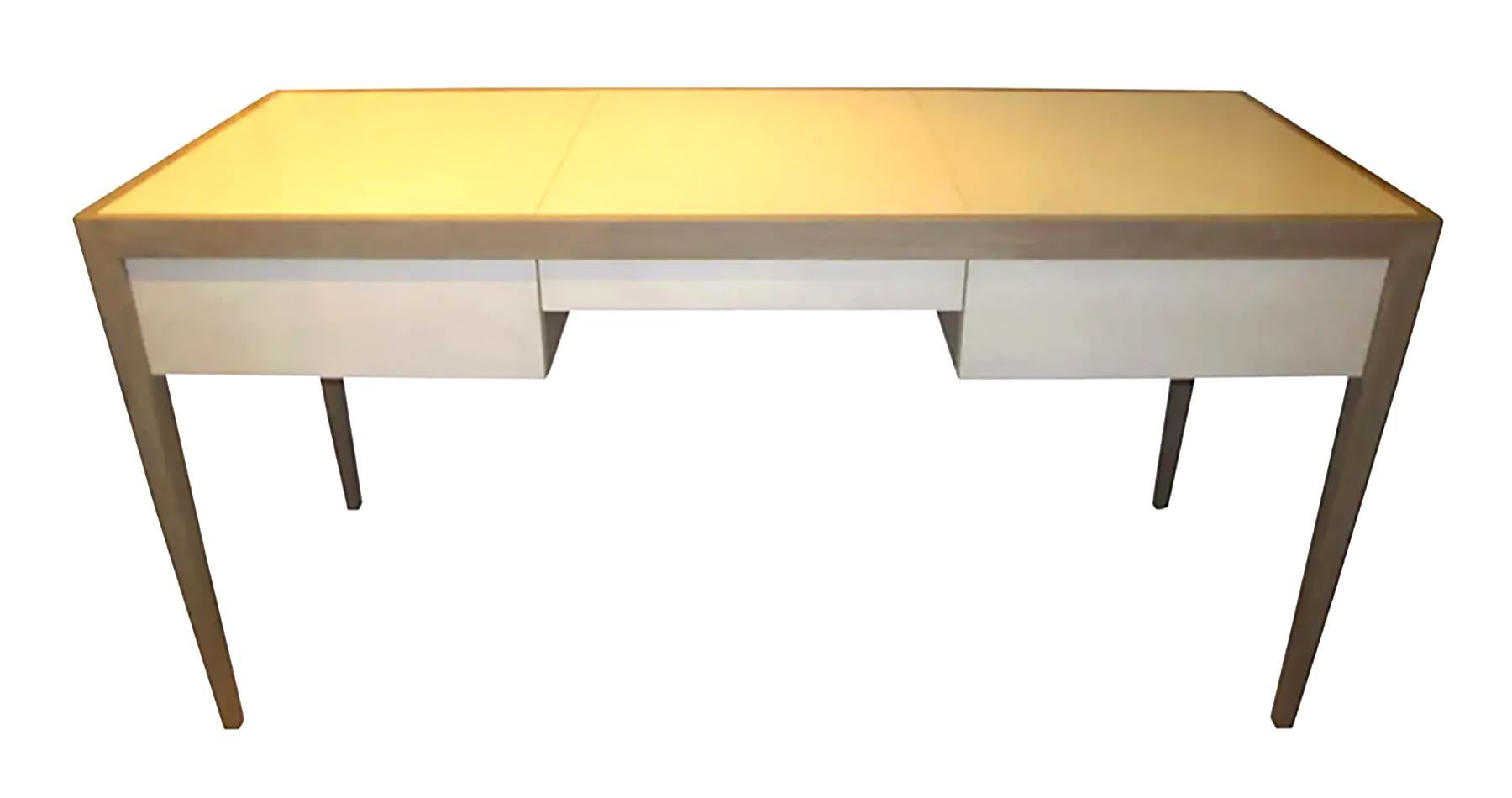 Custom cerused oak and parchment desk featuring three central drawers.
Note the lead time for custom made is 8-12 weeks.