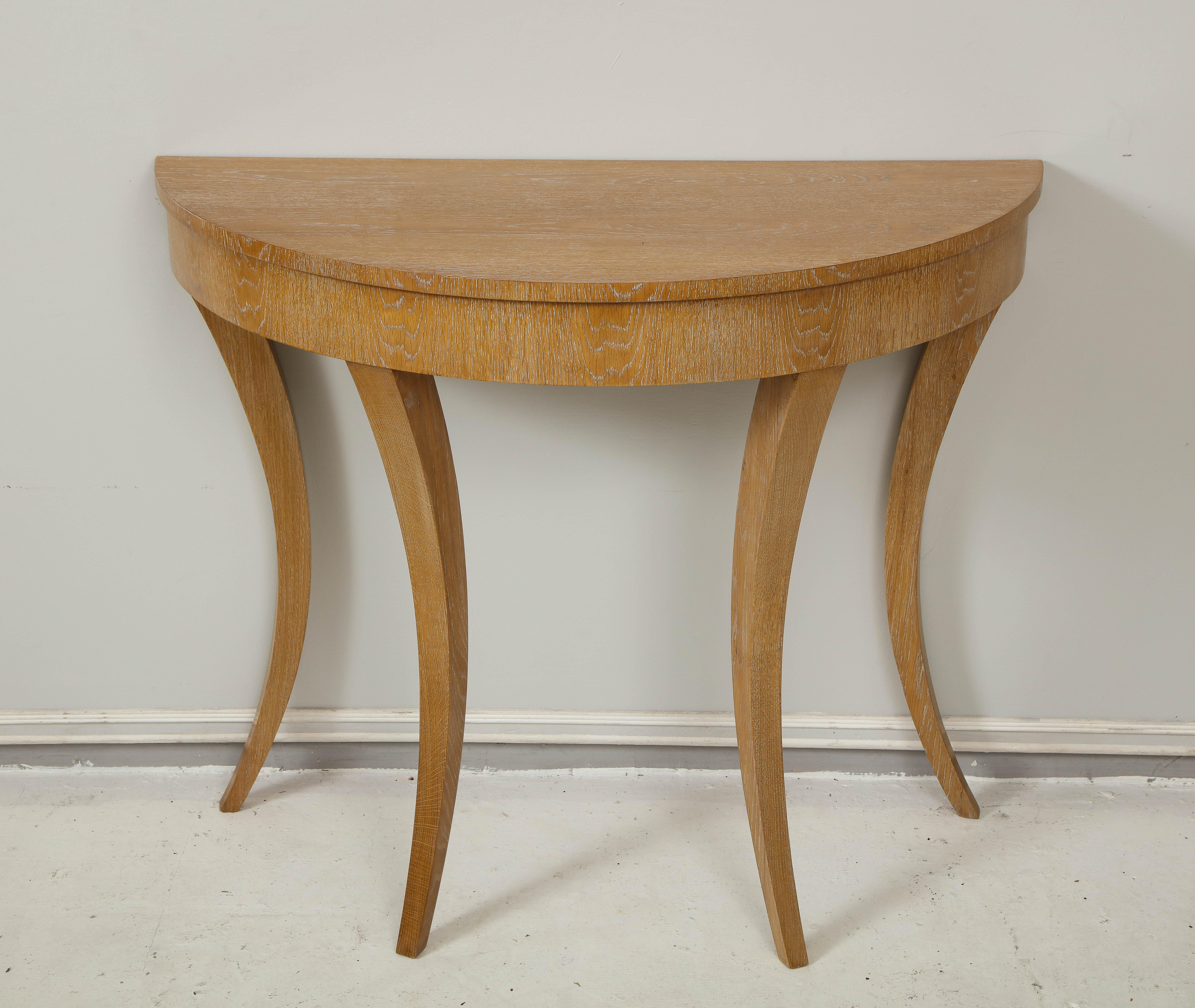 Custom Cerused oak Bobo demiluner console on splayed tapered legs. Please note that this console can be made in any finish and size. This is locally made- lead time is 8-10 weeks - one console is currently in stock.