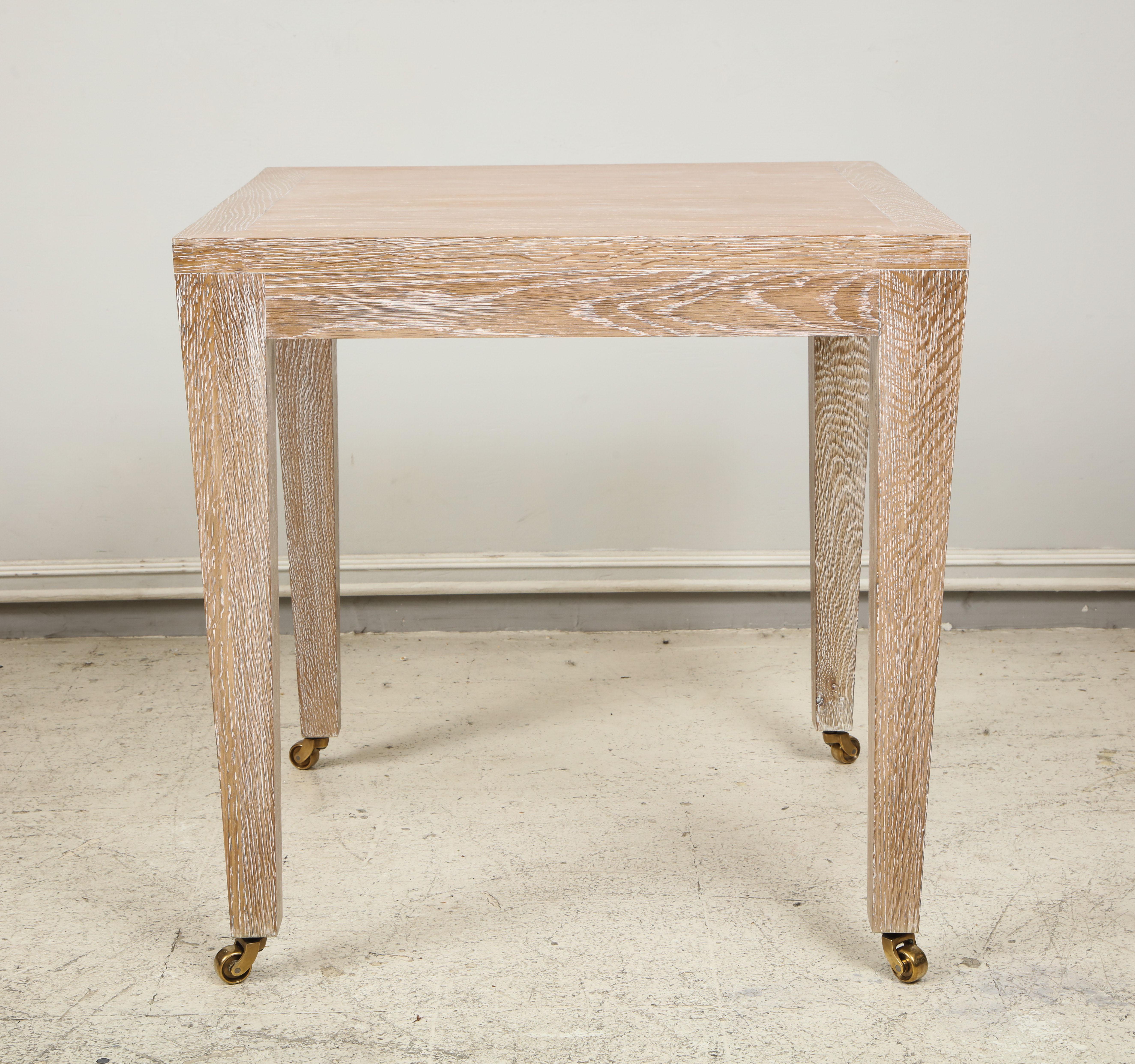 Custom cerused oak square side table on castors. This table is completely customizable and can be made in different finishes.