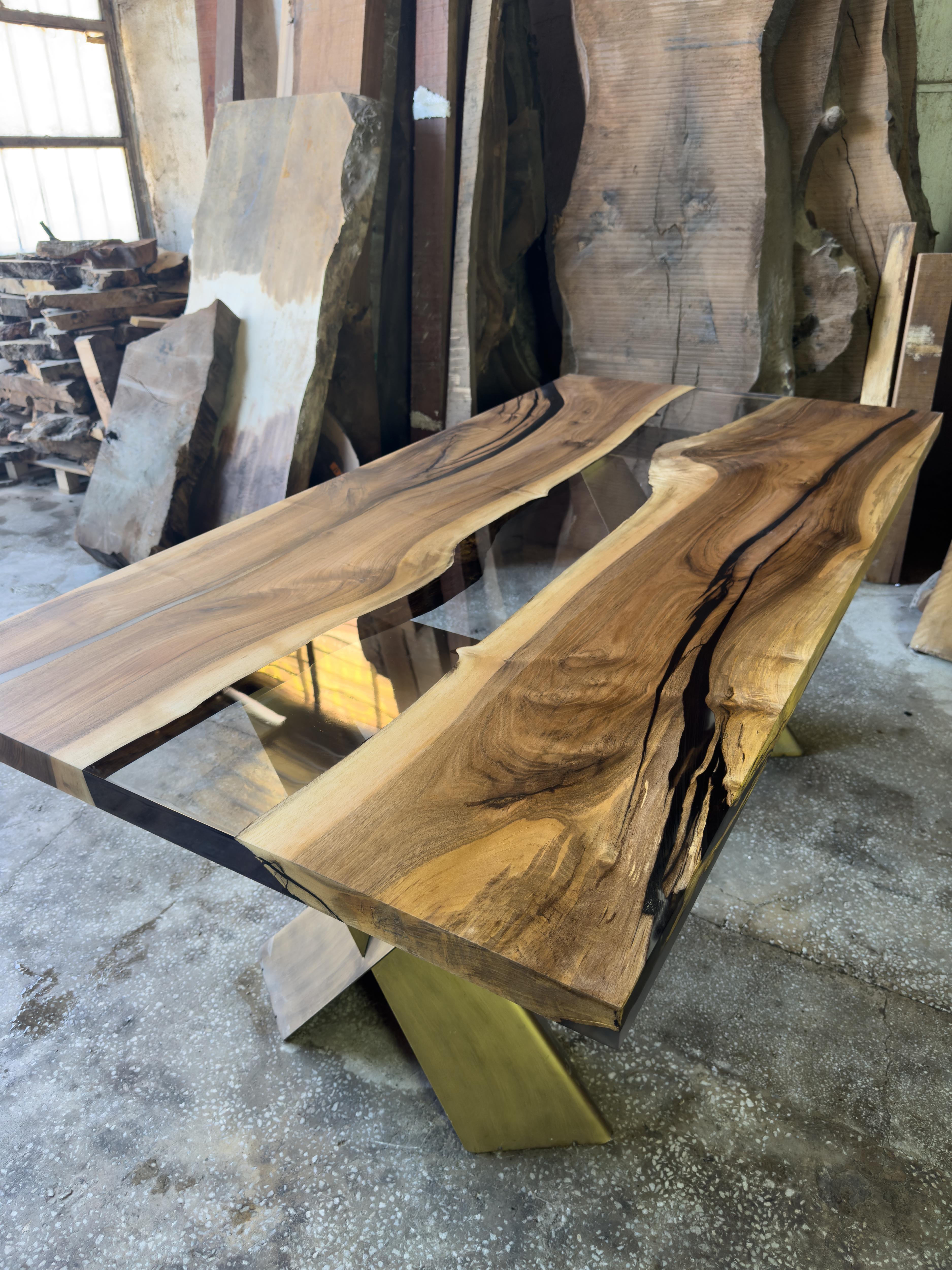 Walnut Custom Clear Epoxy Resin Dining Table 

This table is made of 500 years old Walnut Wood. The grains and texture of the wood describe what a natural walnut woods looks like.
It can be used as a dining table or as a conference table. Suitable
