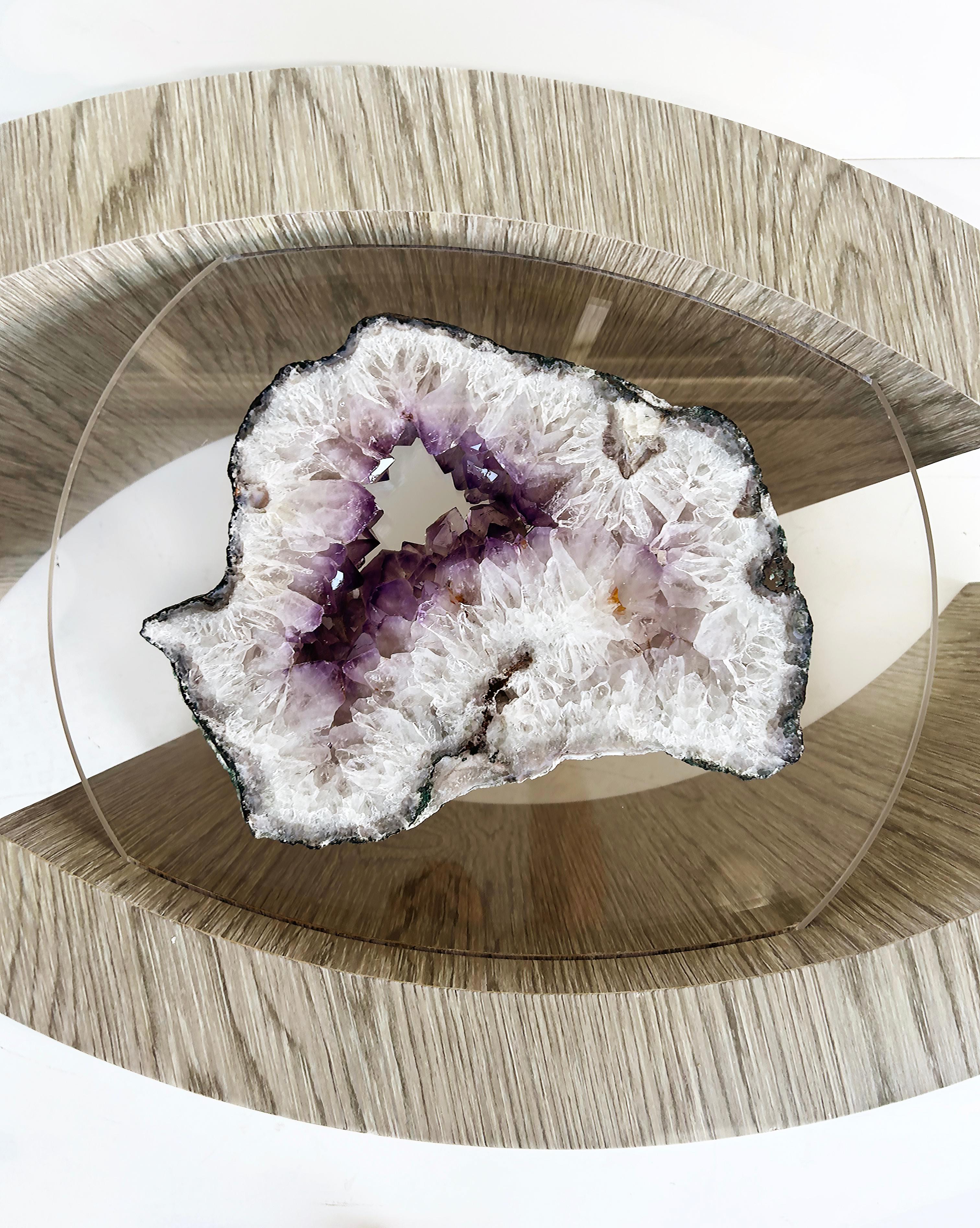 Custom Cocktail Table, Oak Base, Amethyst Ring Crystal Geode Center

Offered for sale is a custom-made coffee table with offset curved oak veneer sides that support a rectangular glass top.  Nested with the curved sides is a floating amethyst ring