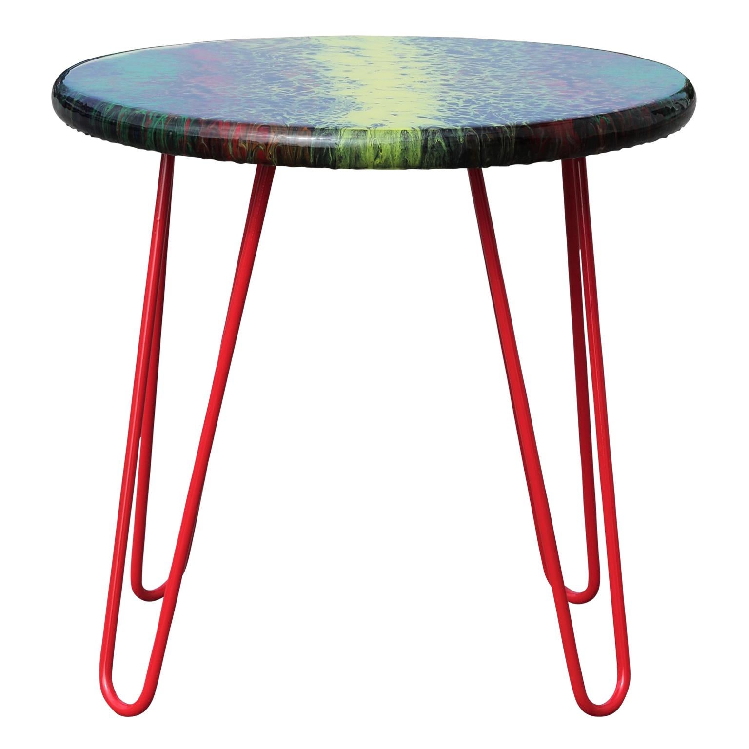 Colorful abstract acrylic fluid painted side table that incorporates hues of black, yellow, green, and red. Signed and dated by the artist (Stephen Alaniz) on the underside of the table.

Artist biography: 