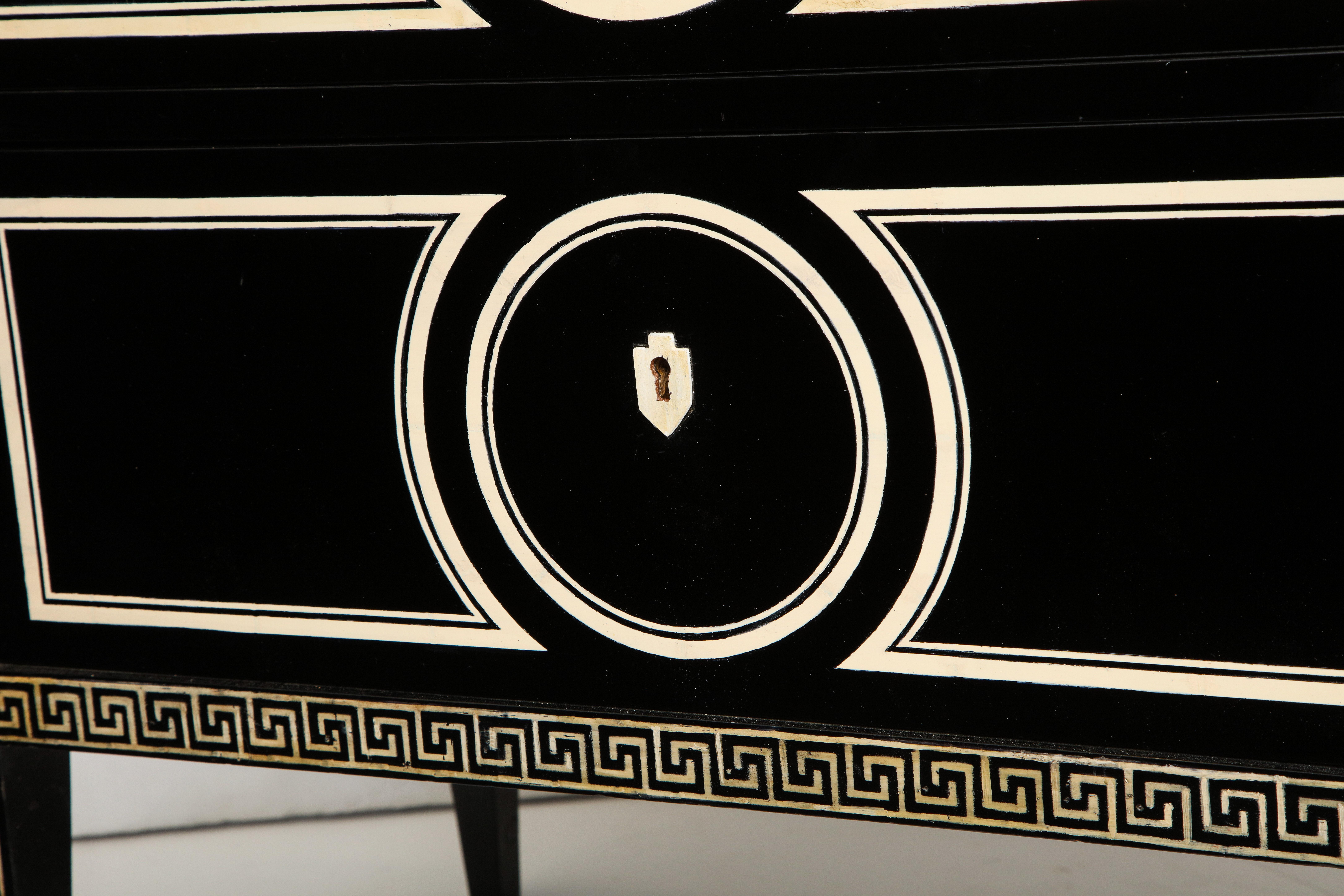 Graphic black and white custom ebonized commode featuring neoclassic hand painted decoration.
Lead Time 8 to 10 weeks.