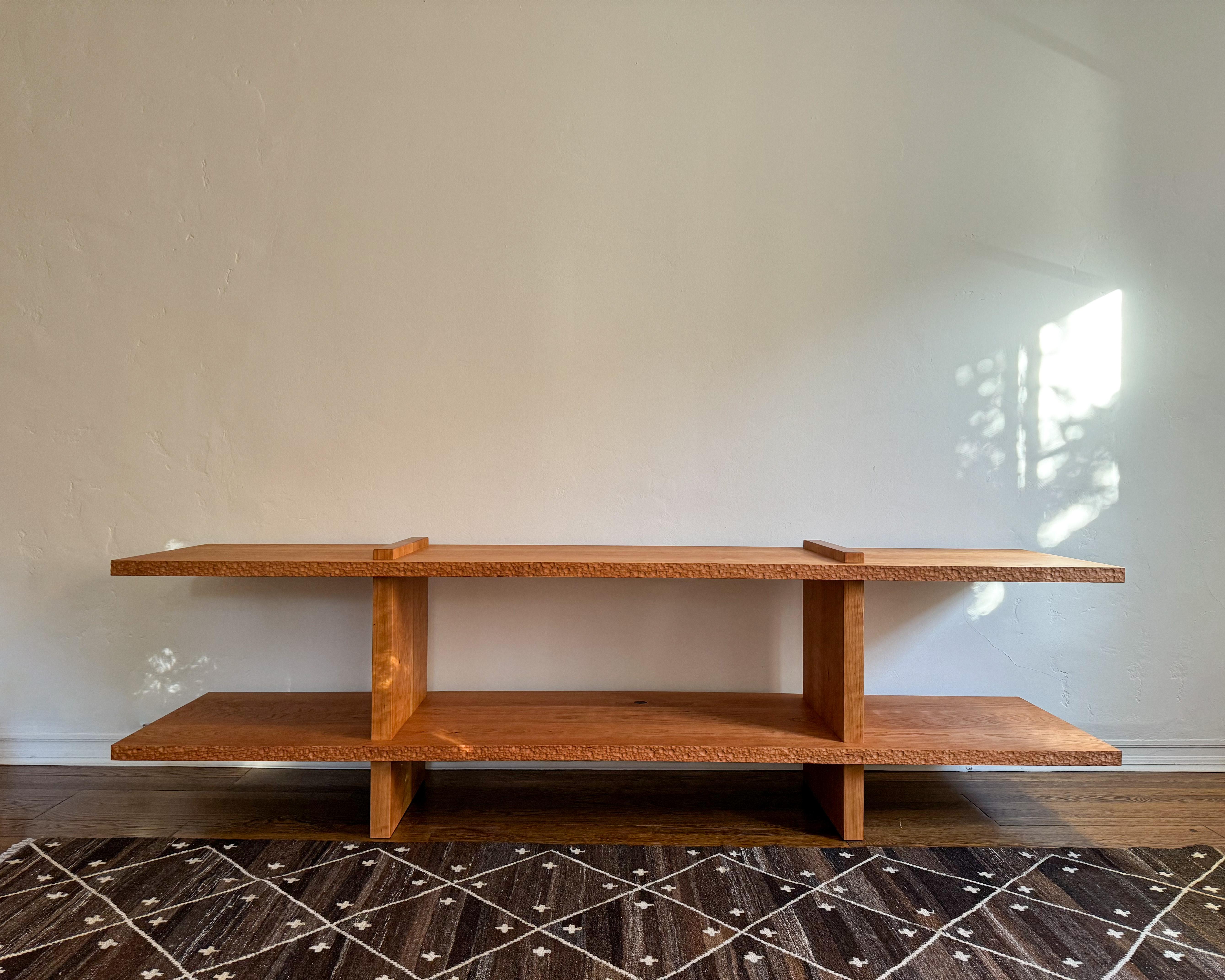 Simple, yet powerful, this large console is beautifully crafted in Cherry, with hand textured edges. 

Made by hand by expert craftsmen in Los Angeles, CA. 

Custom sizes and finishes are available upon request. 

Optional additional finishes