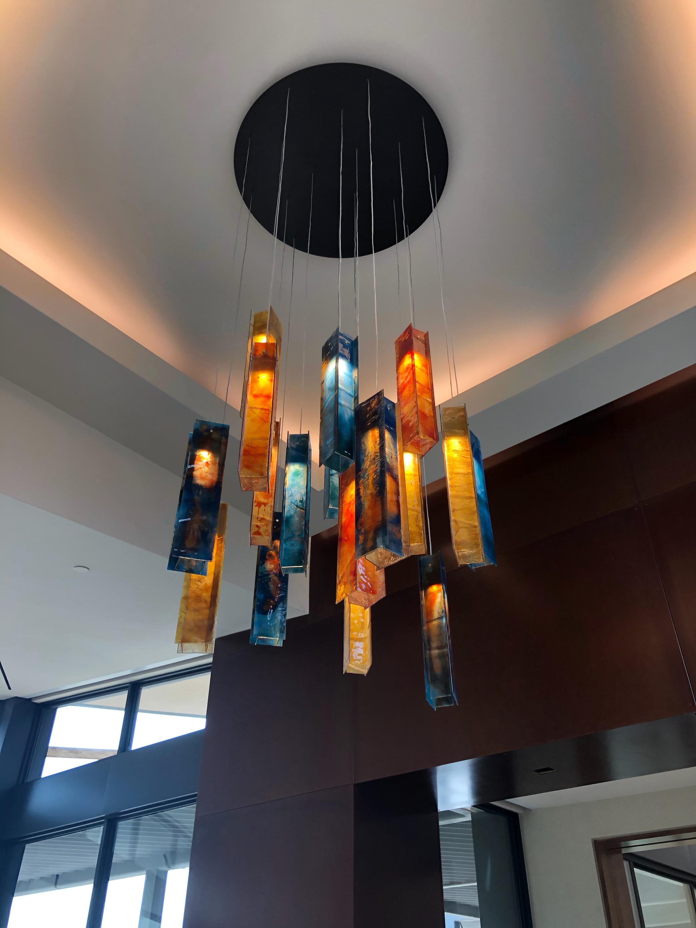 12 Pendant Chandelier 
Glass Colors in Original Picture: Honey, Autumn Red, Ocean
Each rectangular piece is made from 4 glass panels
Height: 17.7” (45 cm)
Width: 3.93” (10 cm)
Depth: 2.36” (6 cm)
Total Drop: Please let us know how high your ceiling