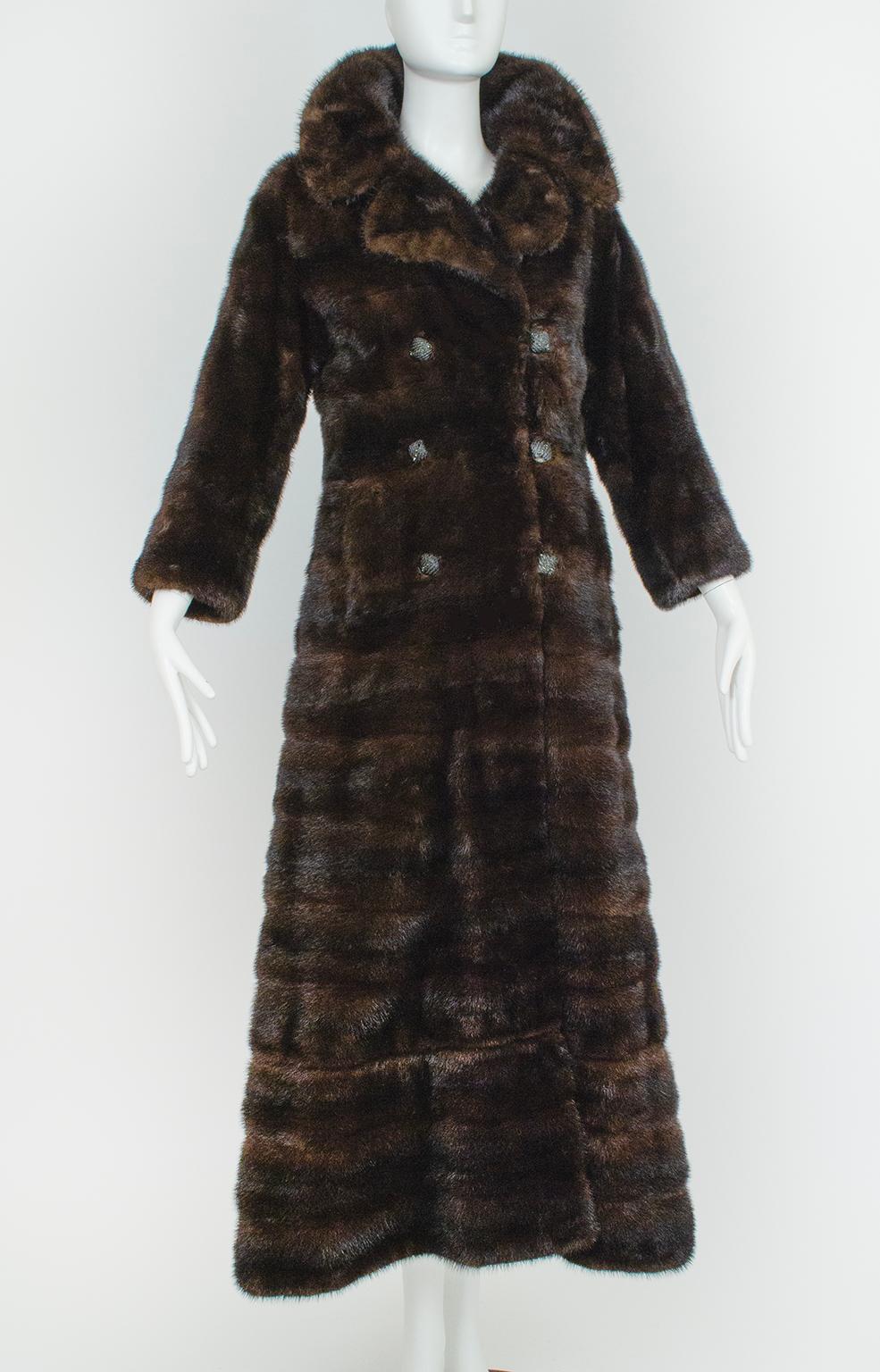 Custom made for its owner in 1971 and professionally stored since, this one-of-a-kind ranch mink coat is remarkable both for its beauty and its practicality. Its horizontal 5” pelts not only create a striking modern geometry, but also accentuate the
