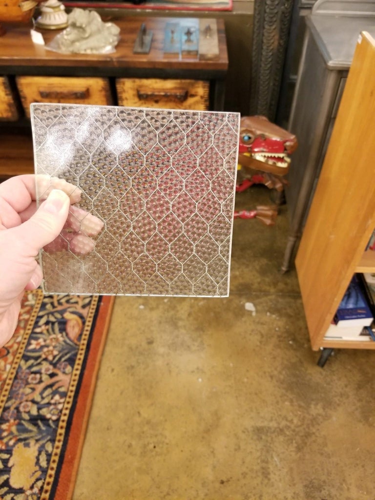 One piece 69 inches H x 23.5 inches W x 0.25 in. D

1920s 'Pebbled' vintage chicken wire glass. All of our chicken wire glass is salvaged from old factory windows and doors. Sizes may be limited. Chicken wire glass comes in a variety of textures: