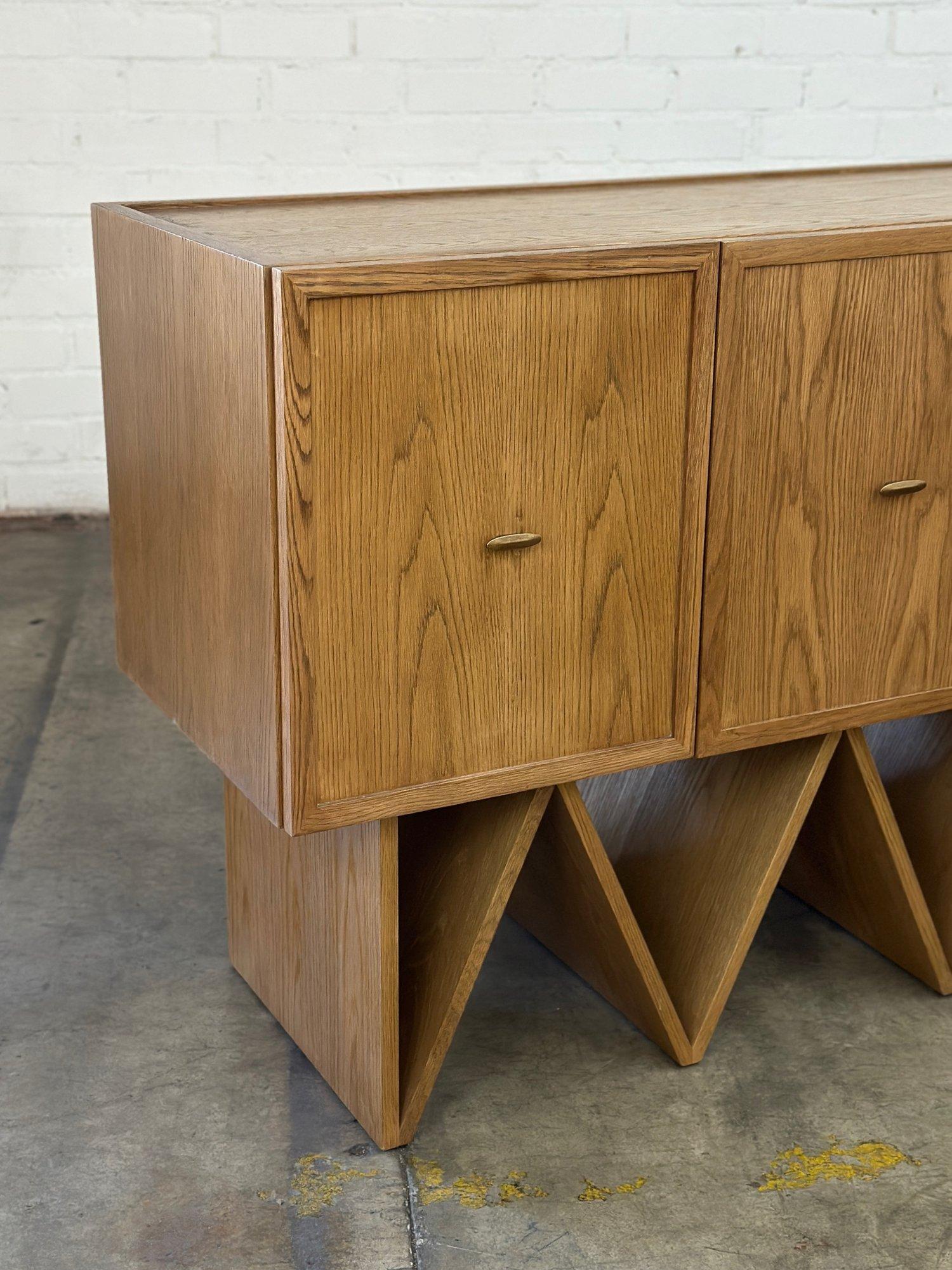 W51 D20.5 H35

Fun refinished credenza custom made for a very prominent hotel in Los Angeles. Credenza has been fully restored and item is structurally sound and fully functional. Item feature thick white oak grain with texture, a fun zigzag base,